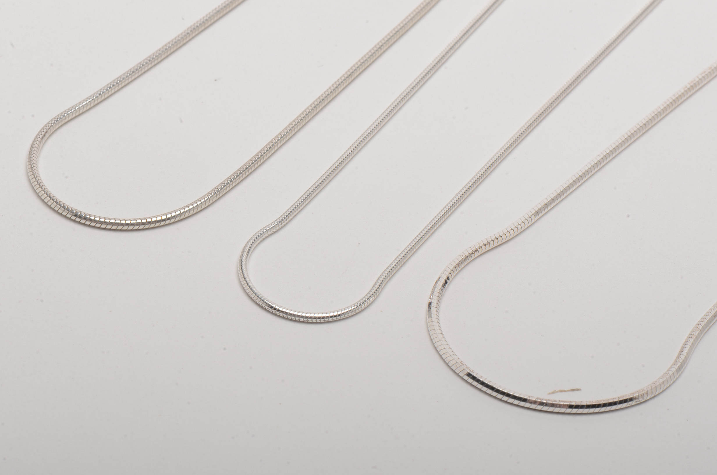 Sterling Silver Snake Chain and Cords With Cross Pendants