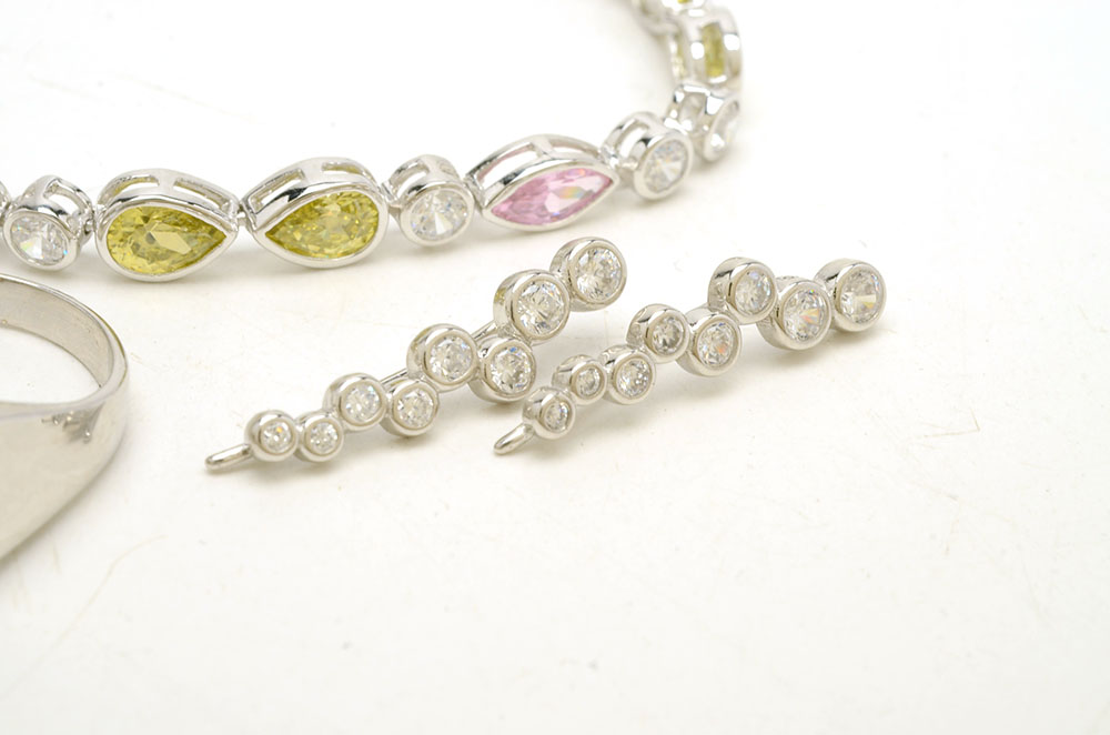 Sterling Jewelry Featuring Blue Topaz and Crystal Stones