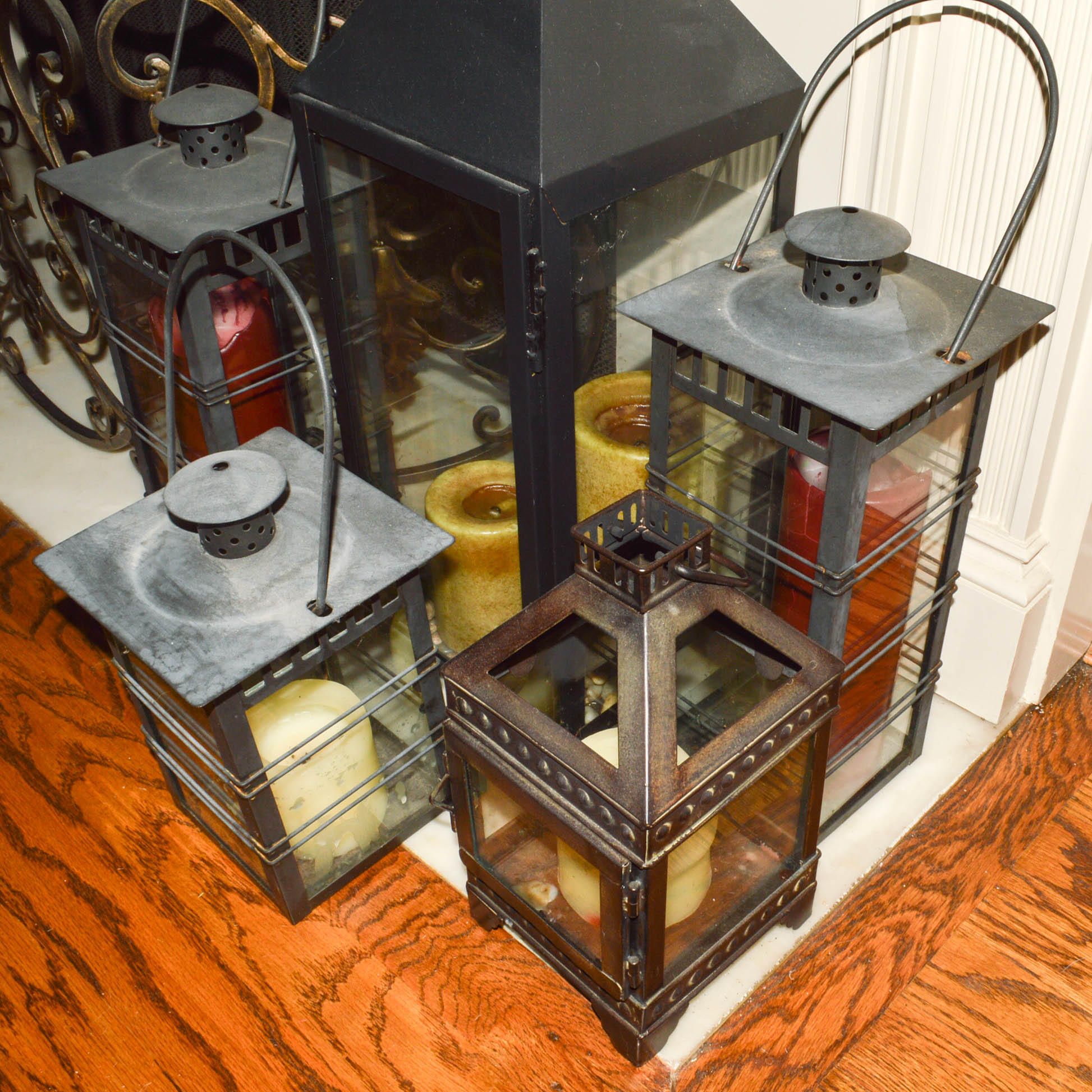Metal Hearth Decor Including a Screen and Lanterns