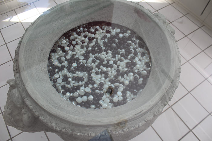 Grecian Inspired Pedestal Table With Glass Top