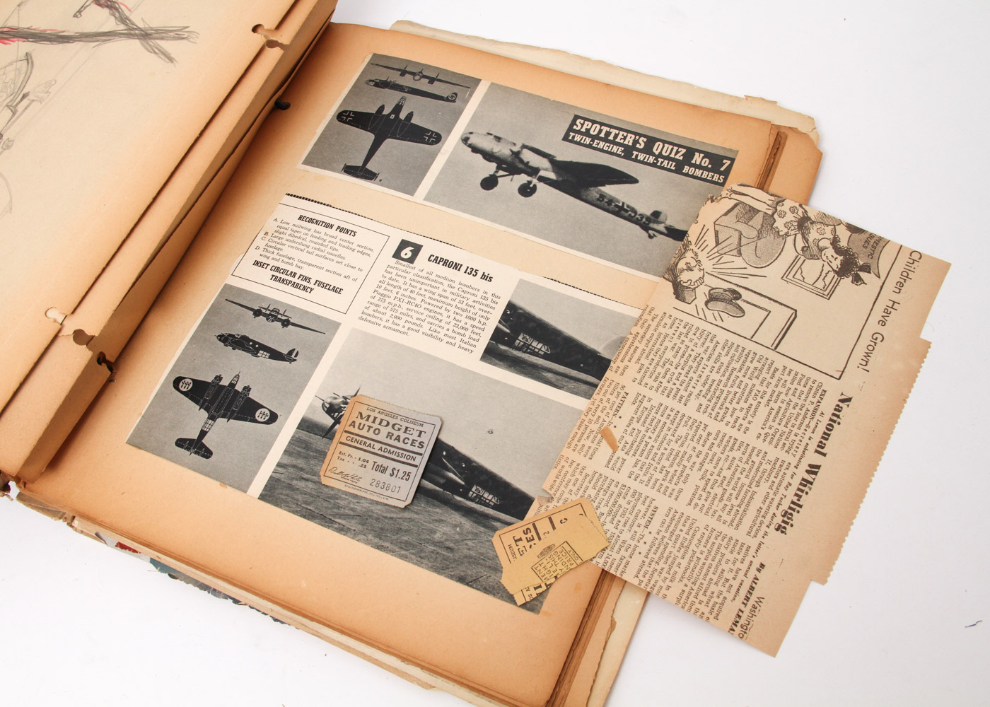 Vintage Scrapbook with WWII Drawings and Clippings