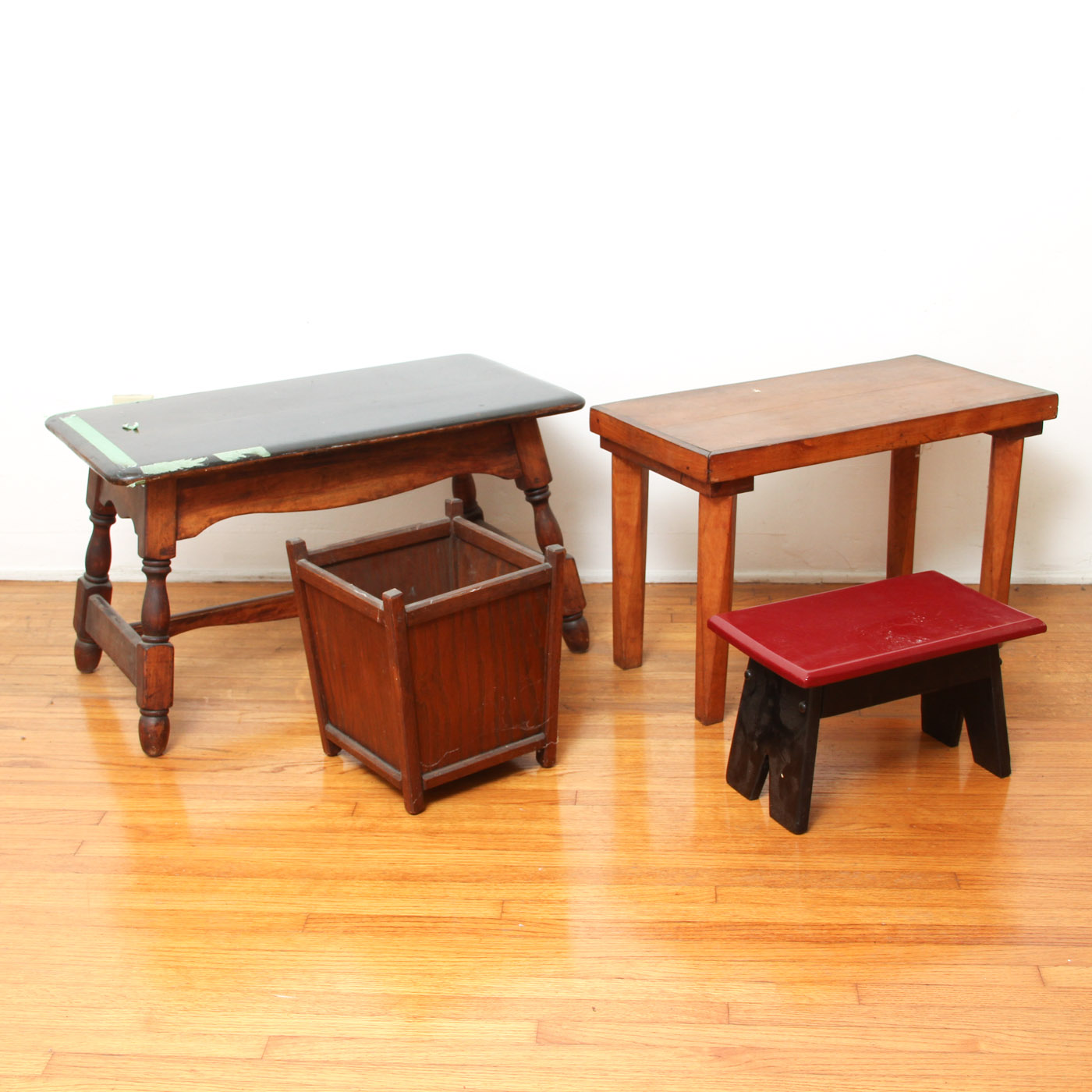Three Wooden Stools and a Wastebasket
