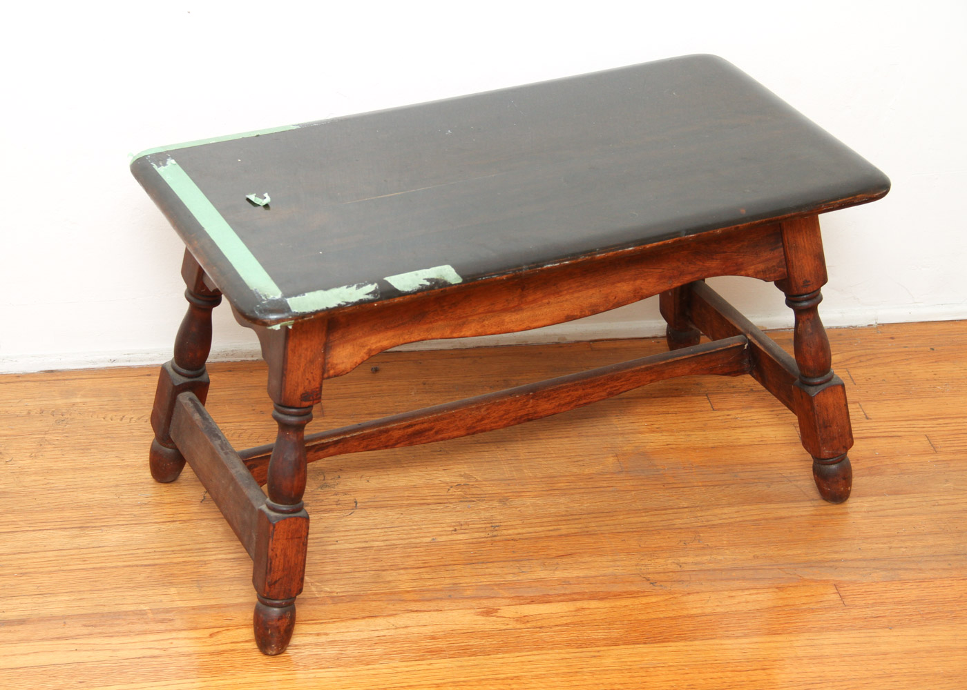 Three Wooden Stools and a Wastebasket