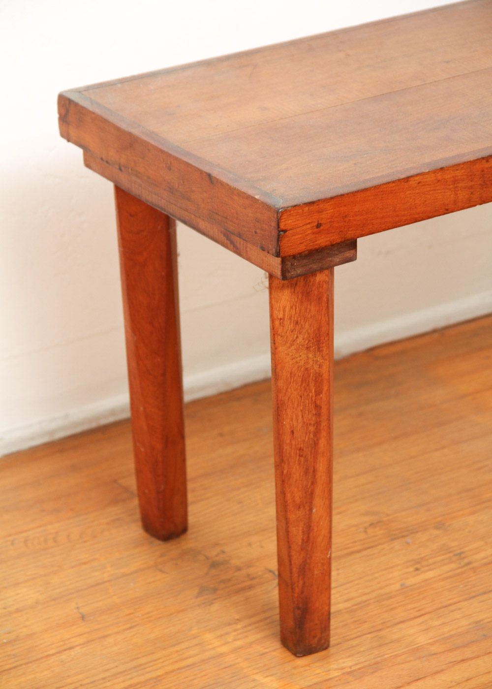 Three Wooden Stools and a Wastebasket
