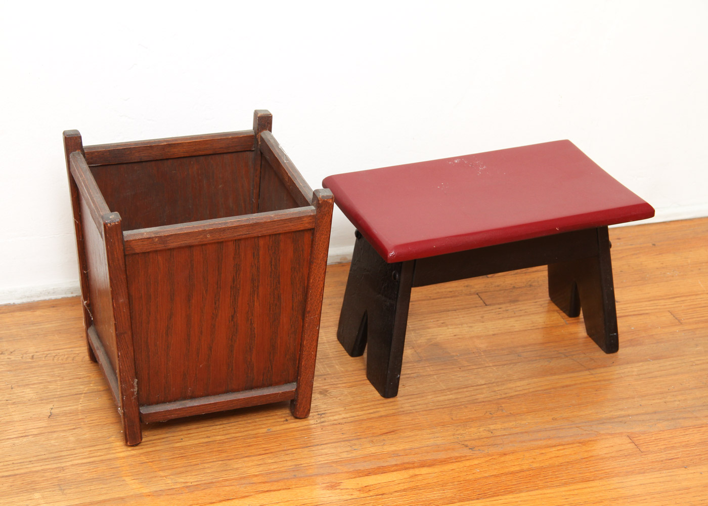 Three Wooden Stools and a Wastebasket