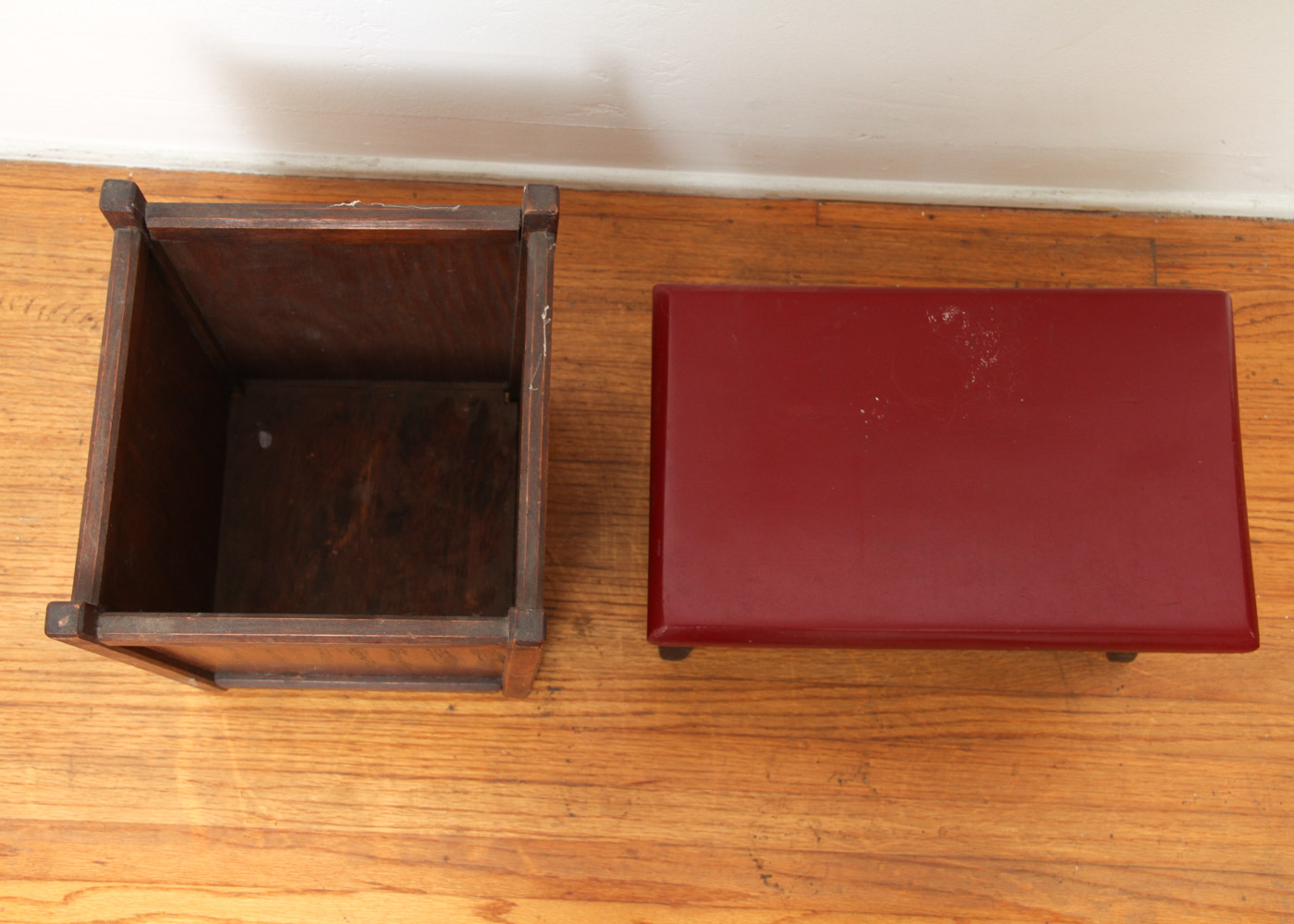 Three Wooden Stools and a Wastebasket