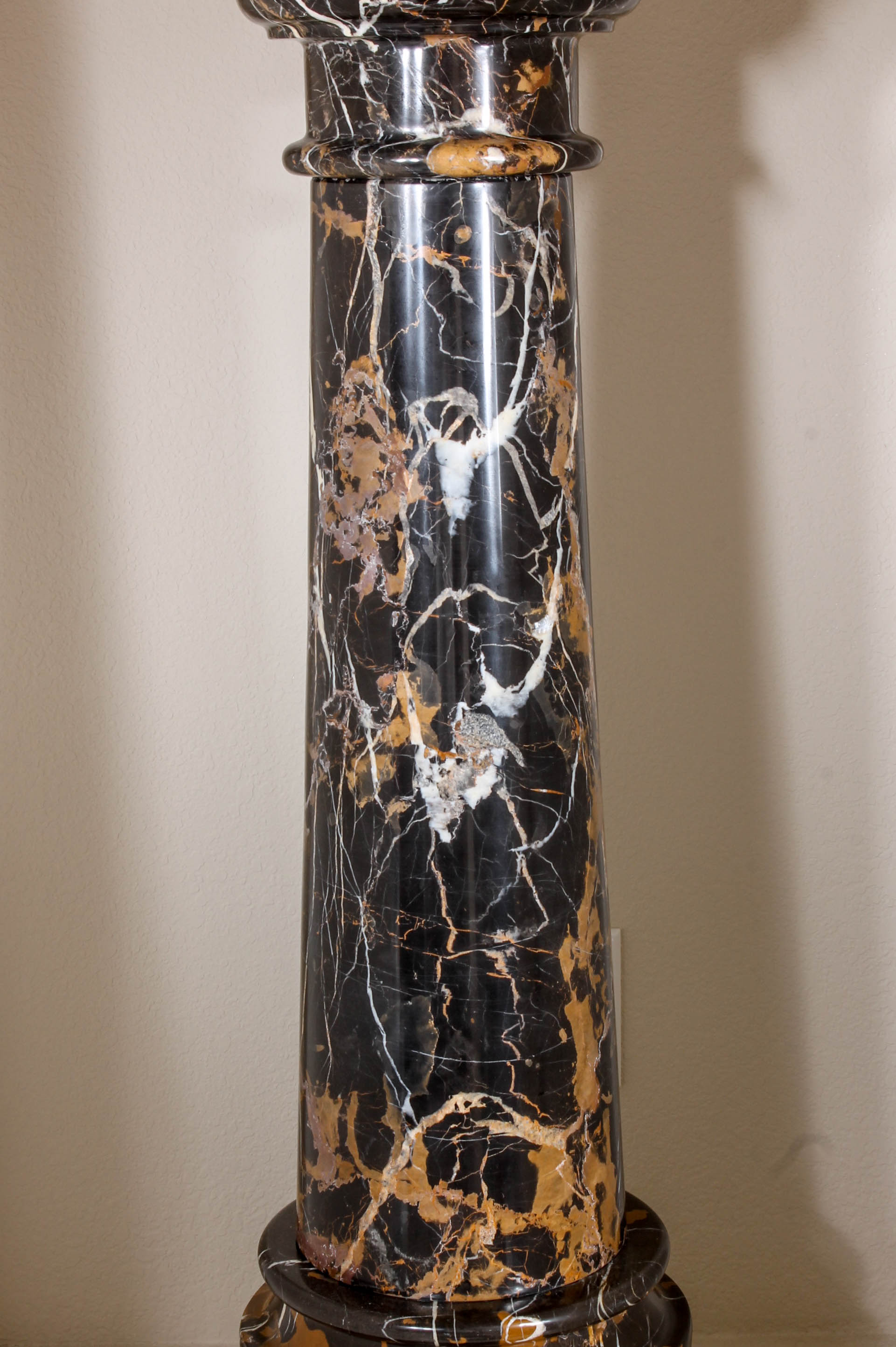 Pair of Black and Brown Marble Pillars