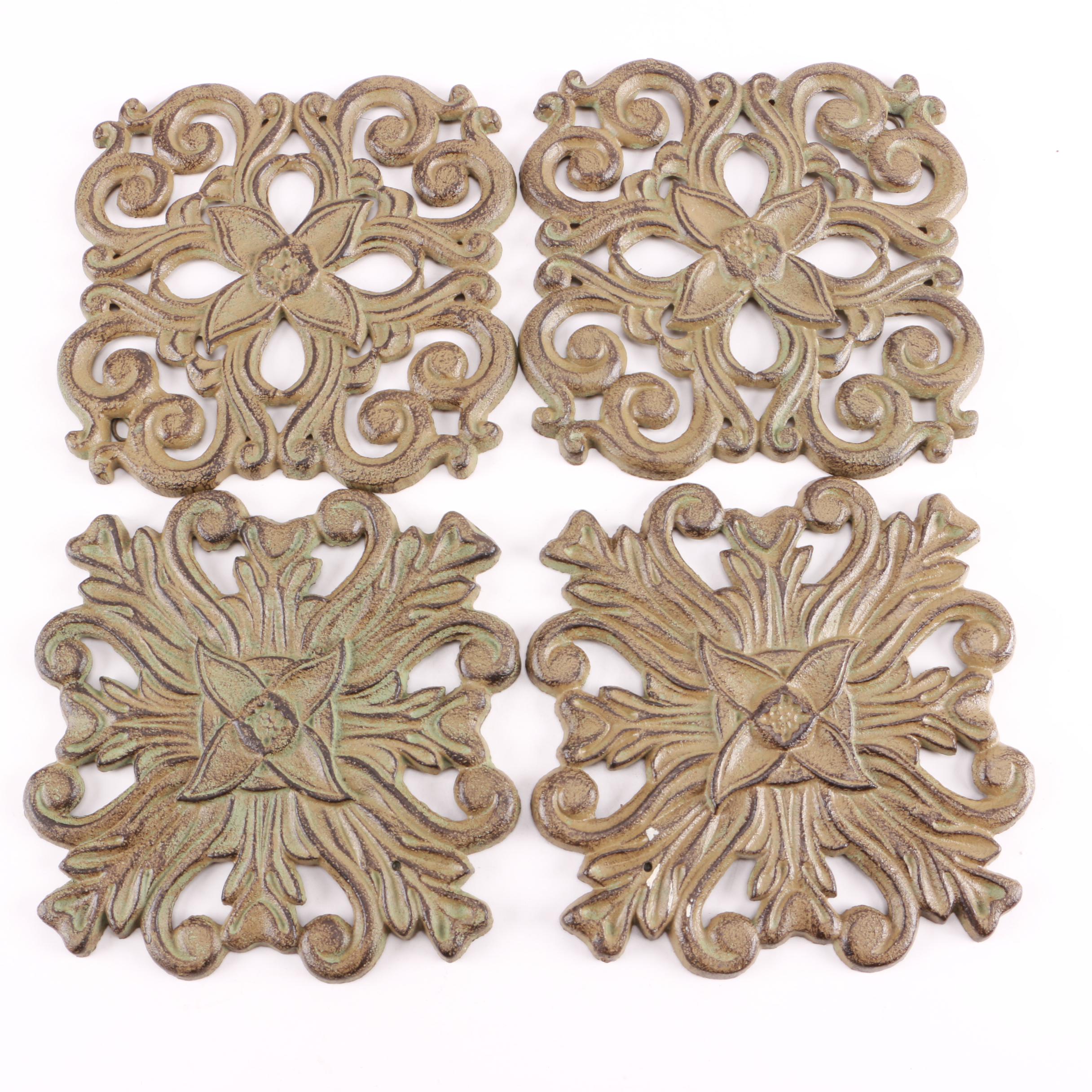 Four Decorative Cast Iron Trivets