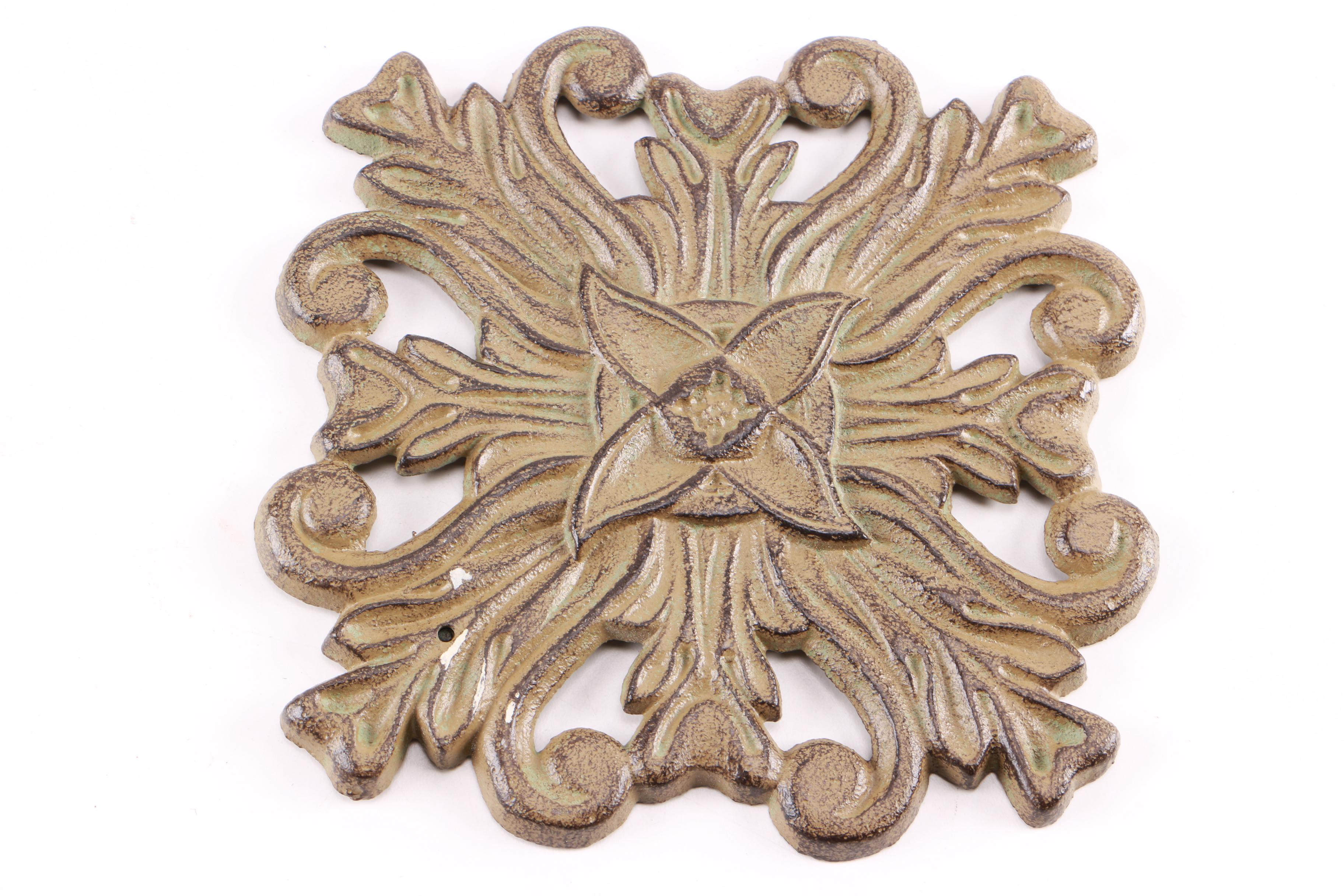 Four Decorative Cast Iron Trivets