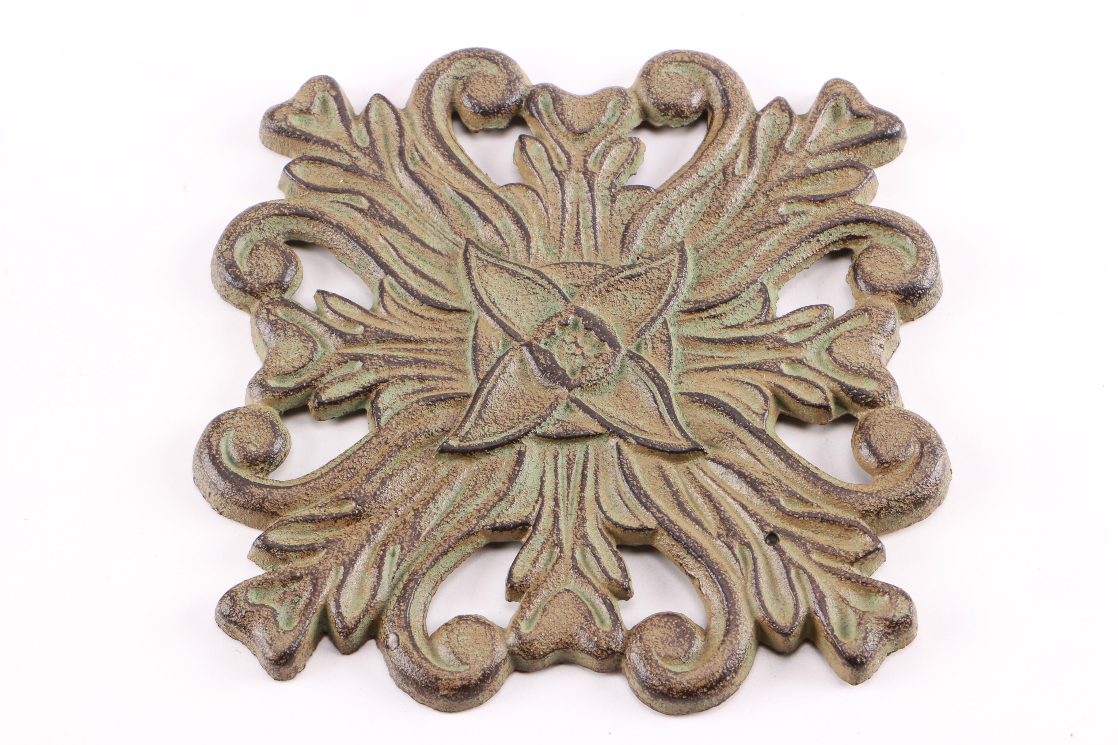 Four Decorative Cast Iron Trivets