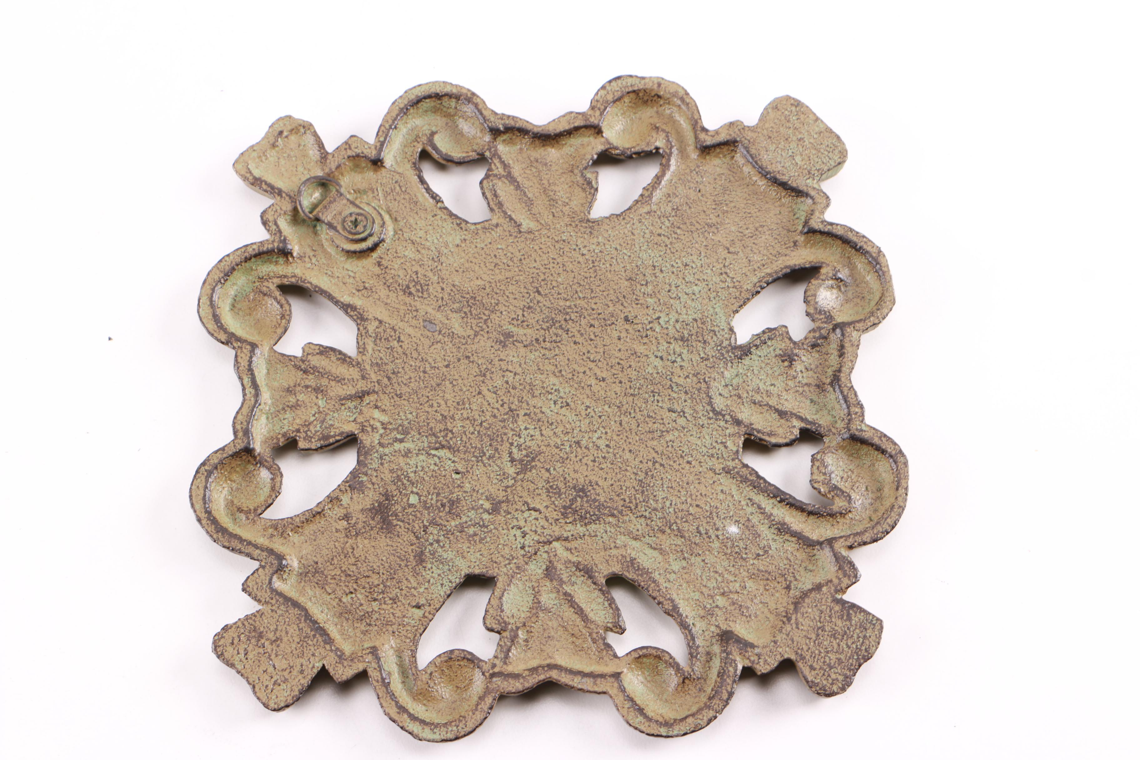 Four Decorative Cast Iron Trivets