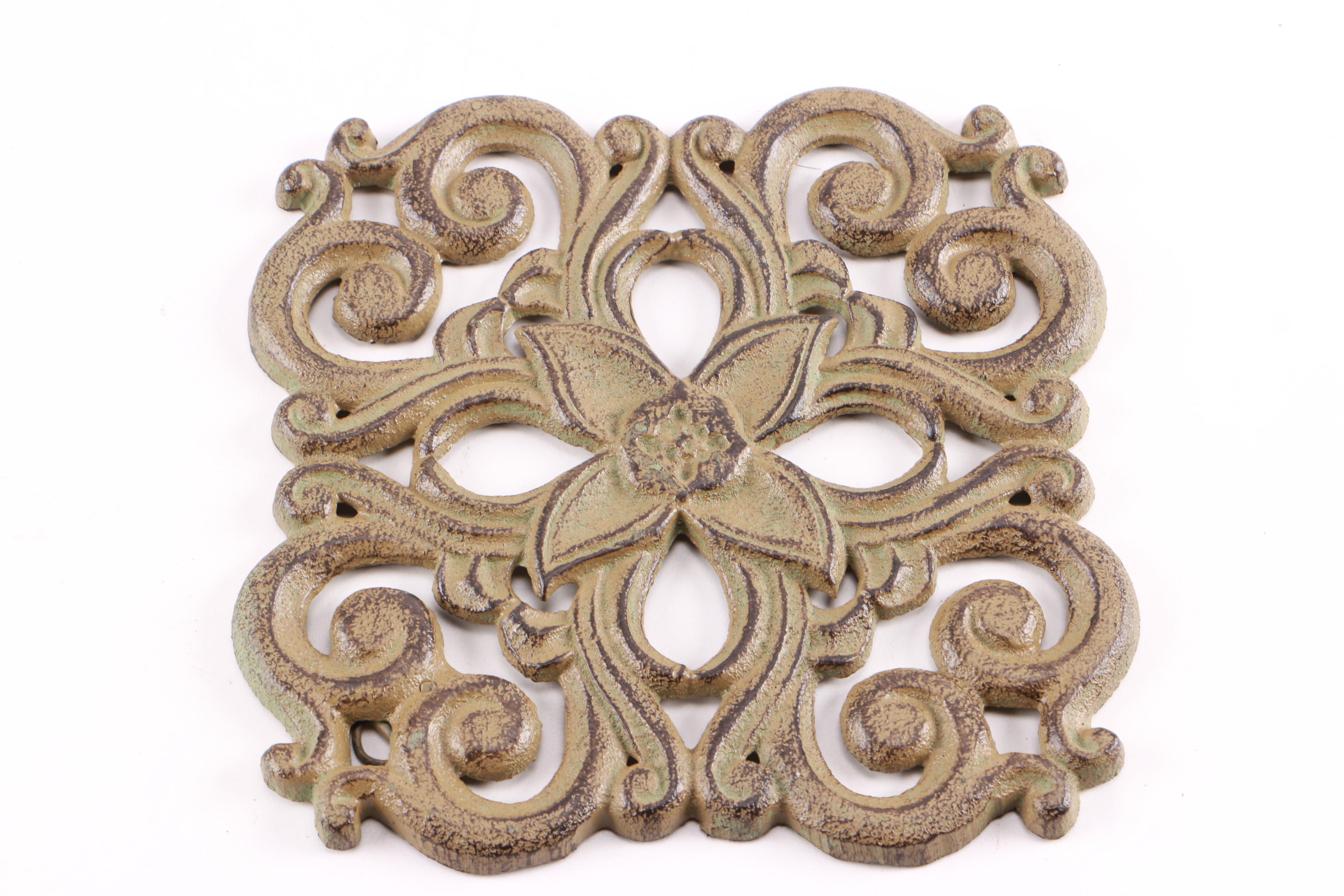 Four Decorative Cast Iron Trivets