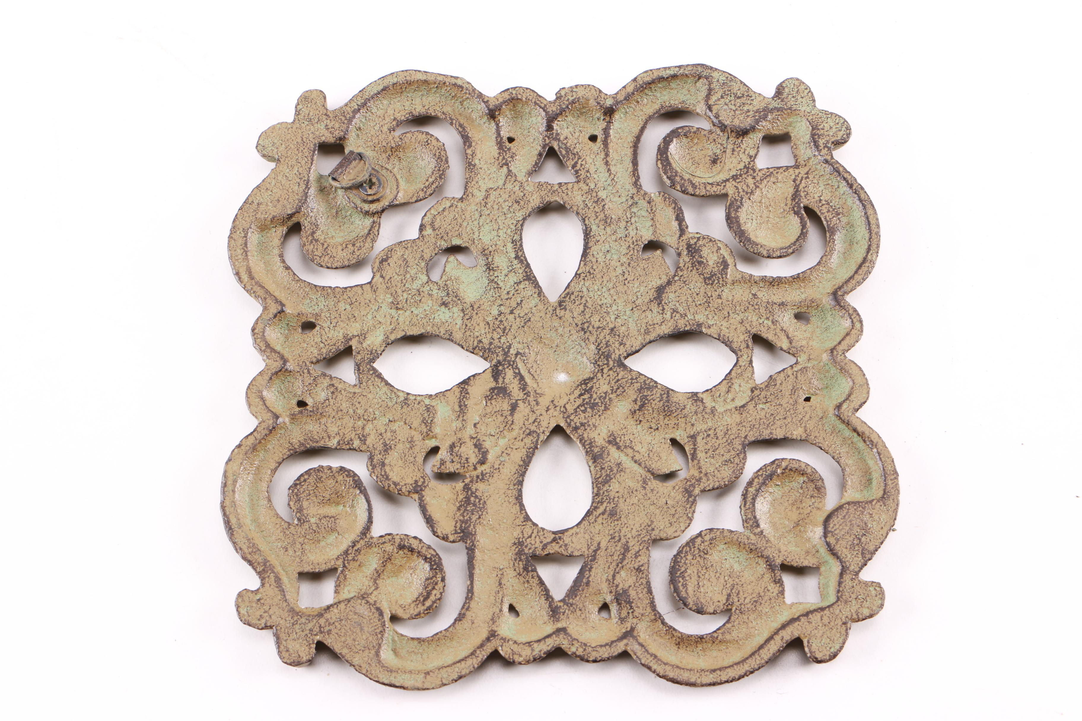 Four Decorative Cast Iron Trivets