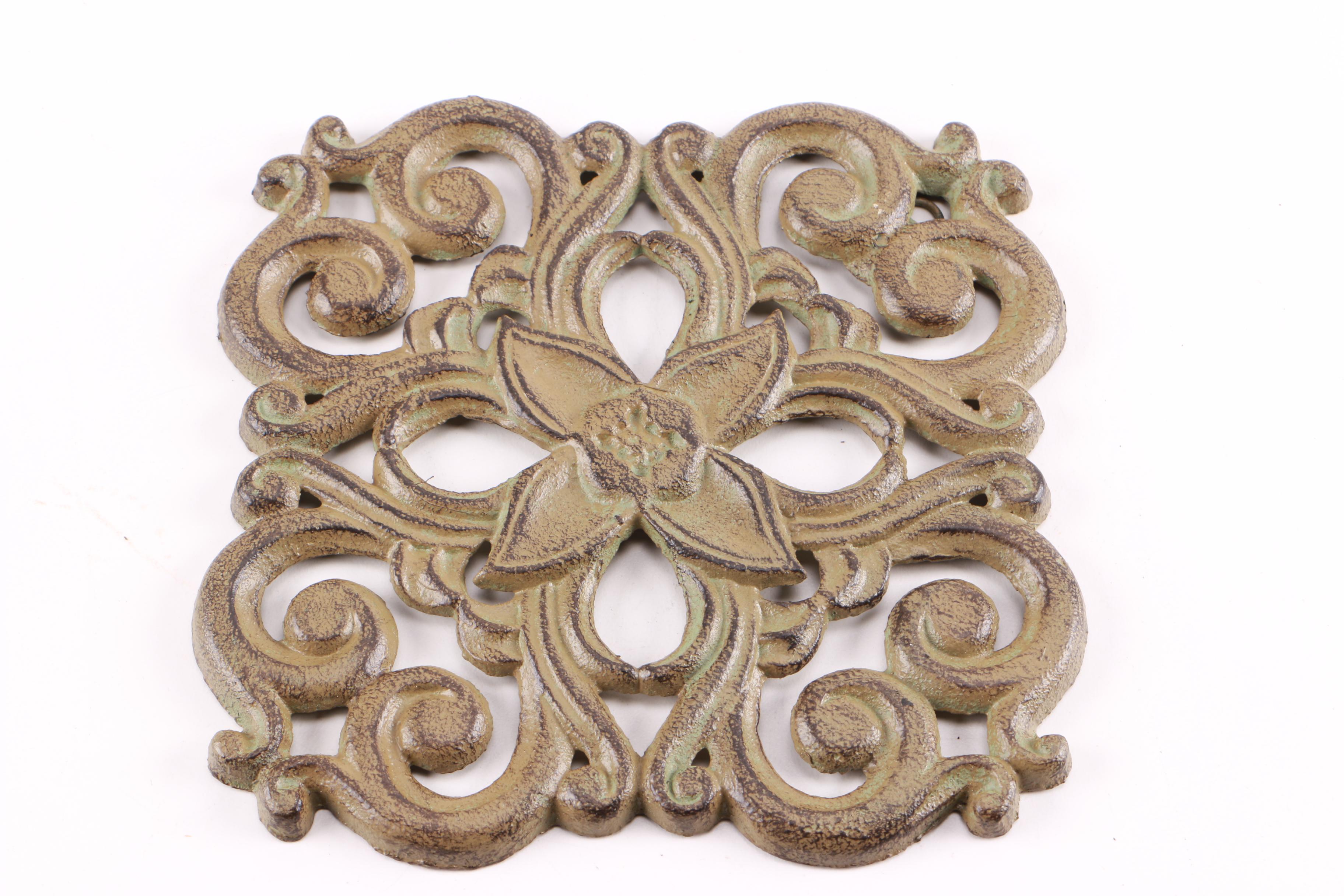 Four Decorative Cast Iron Trivets