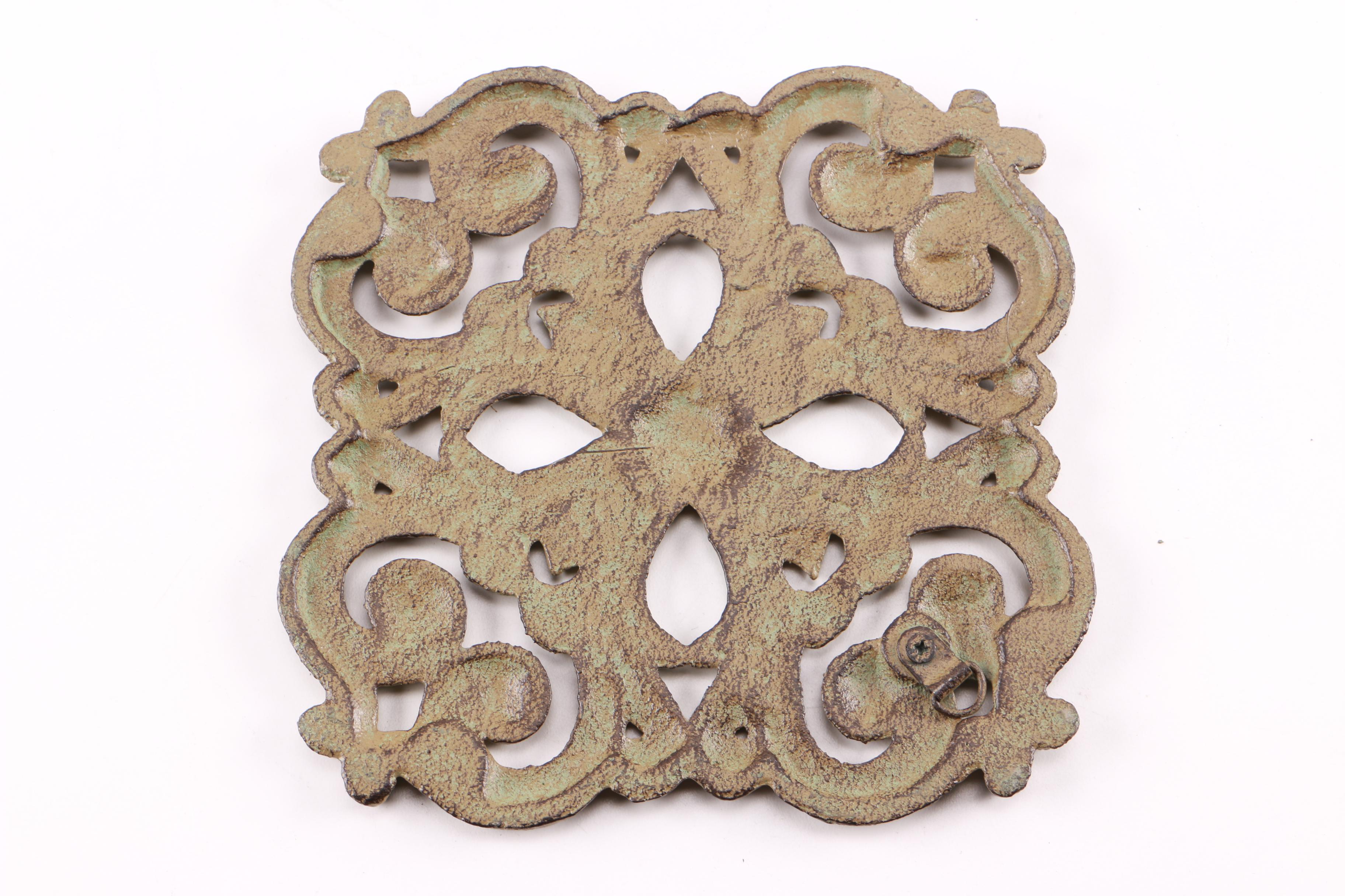 Four Decorative Cast Iron Trivets