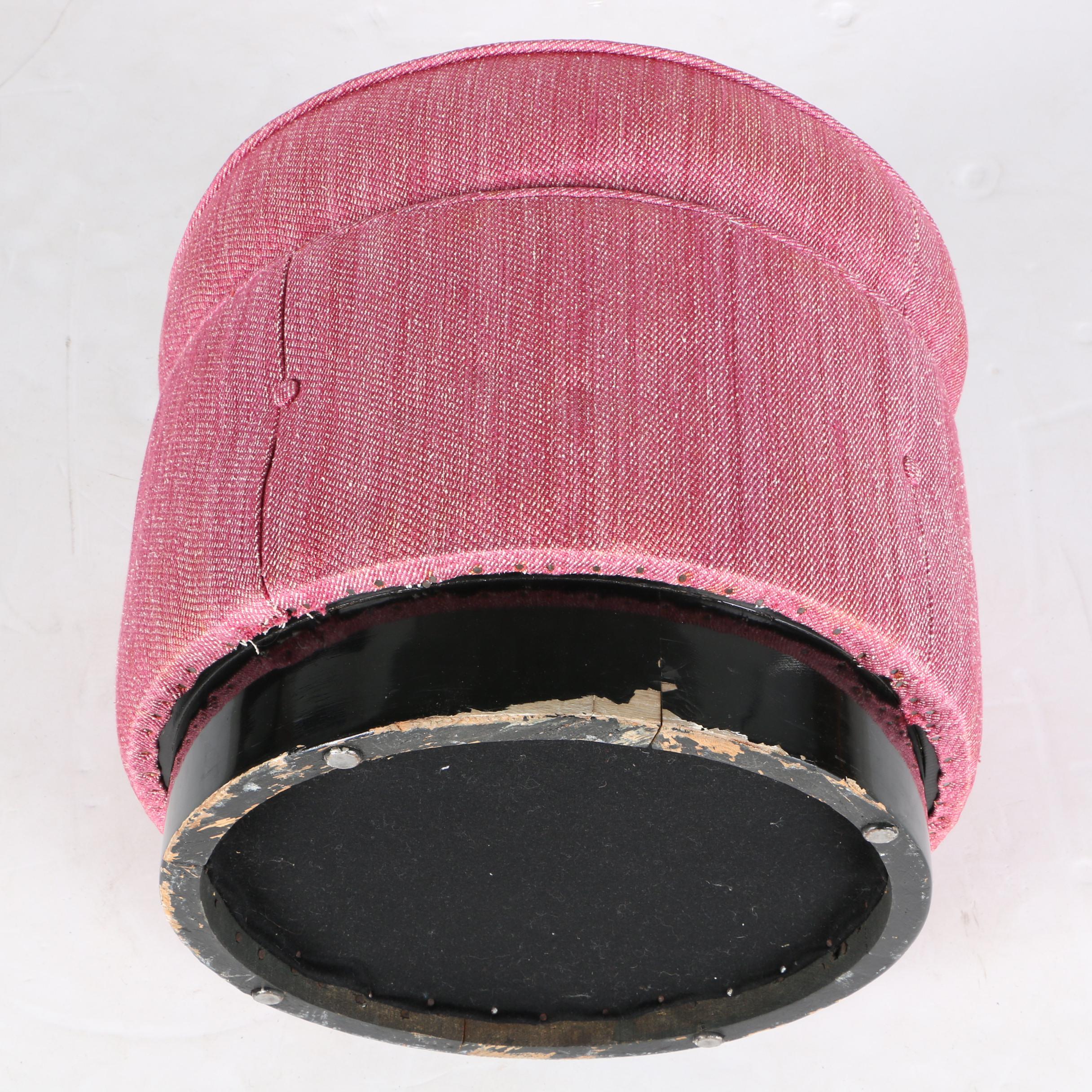 Round Pink-Upholstered Ottoman