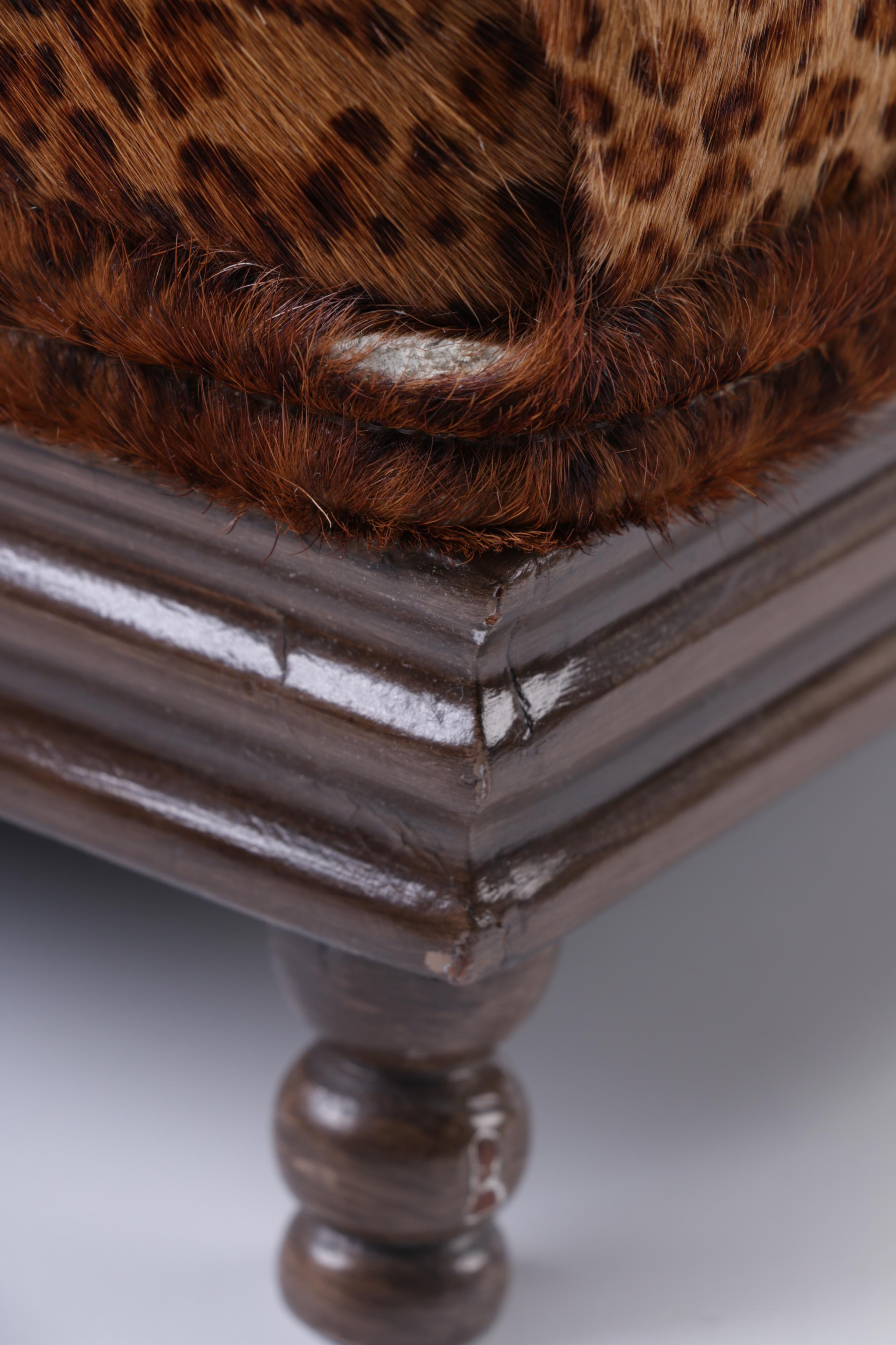 Upholstered Leopard Print Ottoman