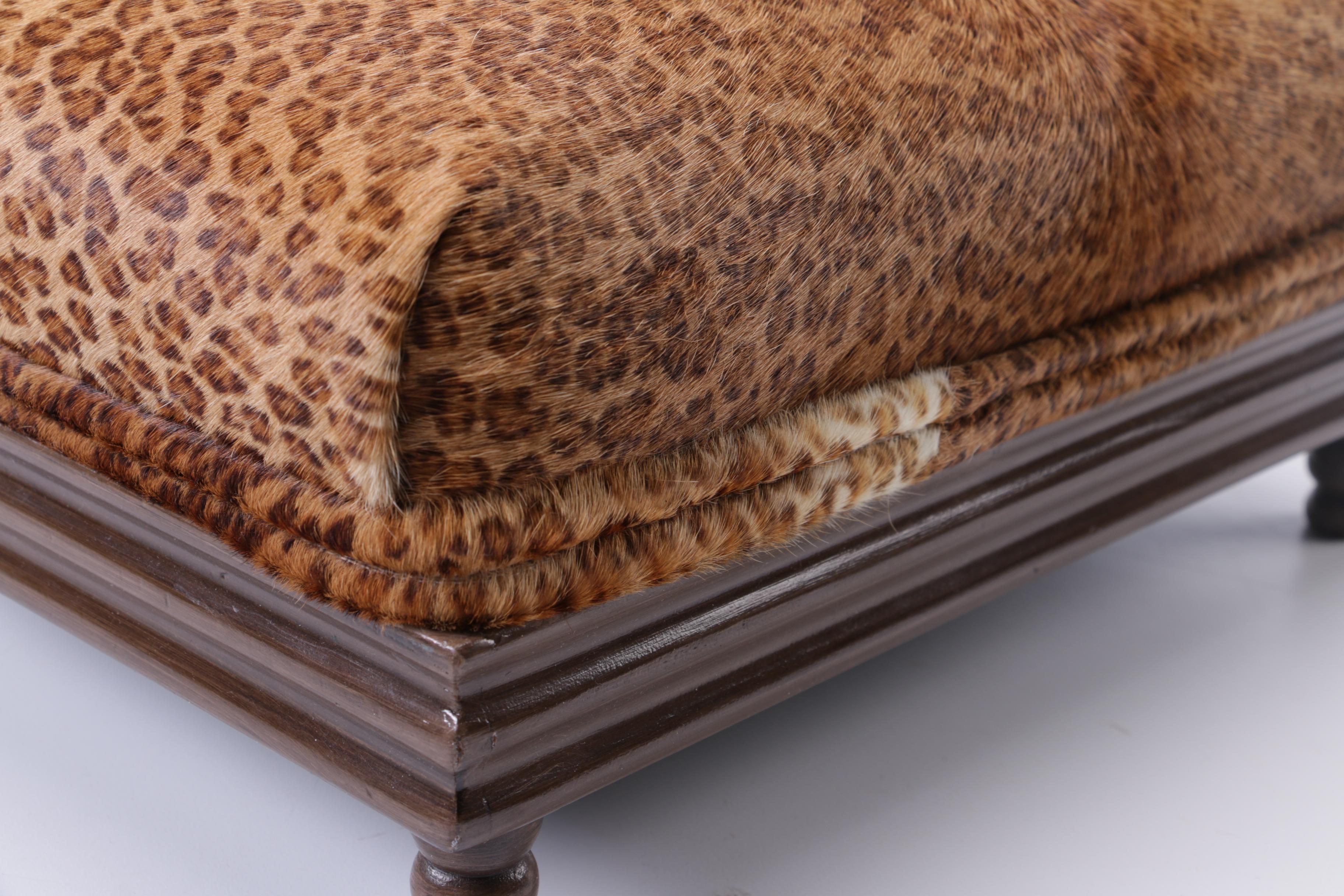 Upholstered Leopard Print Ottoman