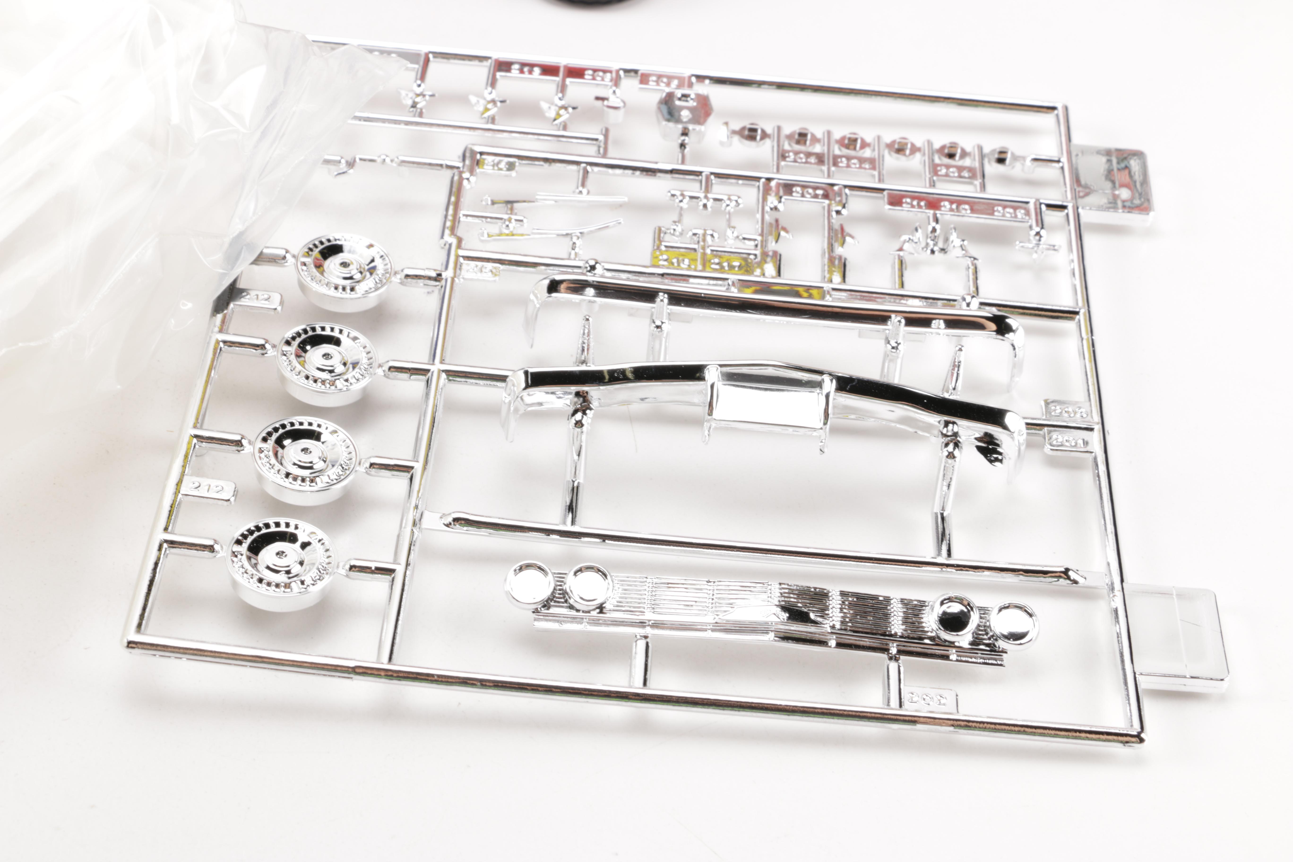 Assortment of Chevy Impala Model Kits and Die-Cast Cars