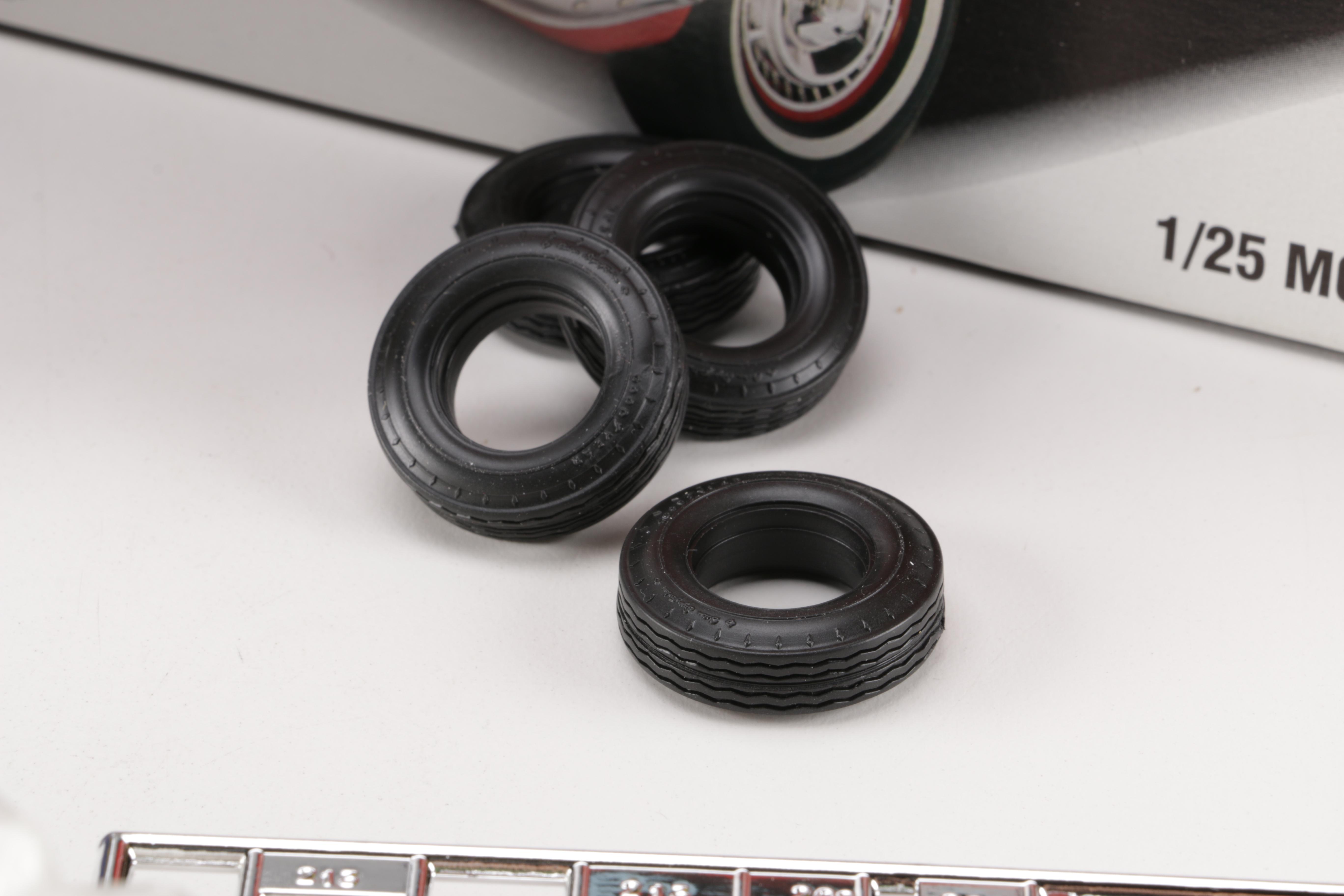 Assortment of Chevy Impala Model Kits and Die-Cast Cars