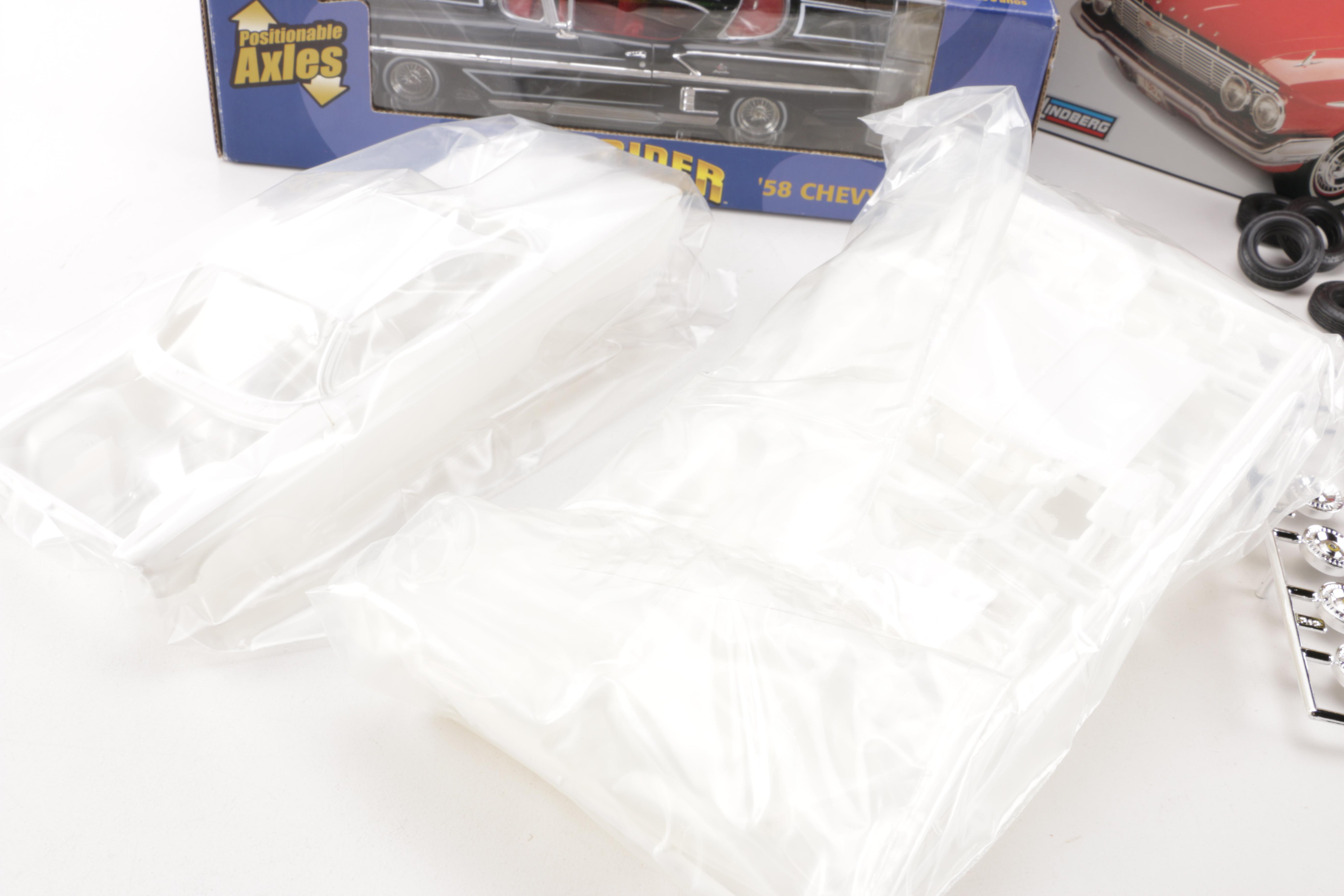 Assortment of Chevy Impala Model Kits and Die-Cast Cars