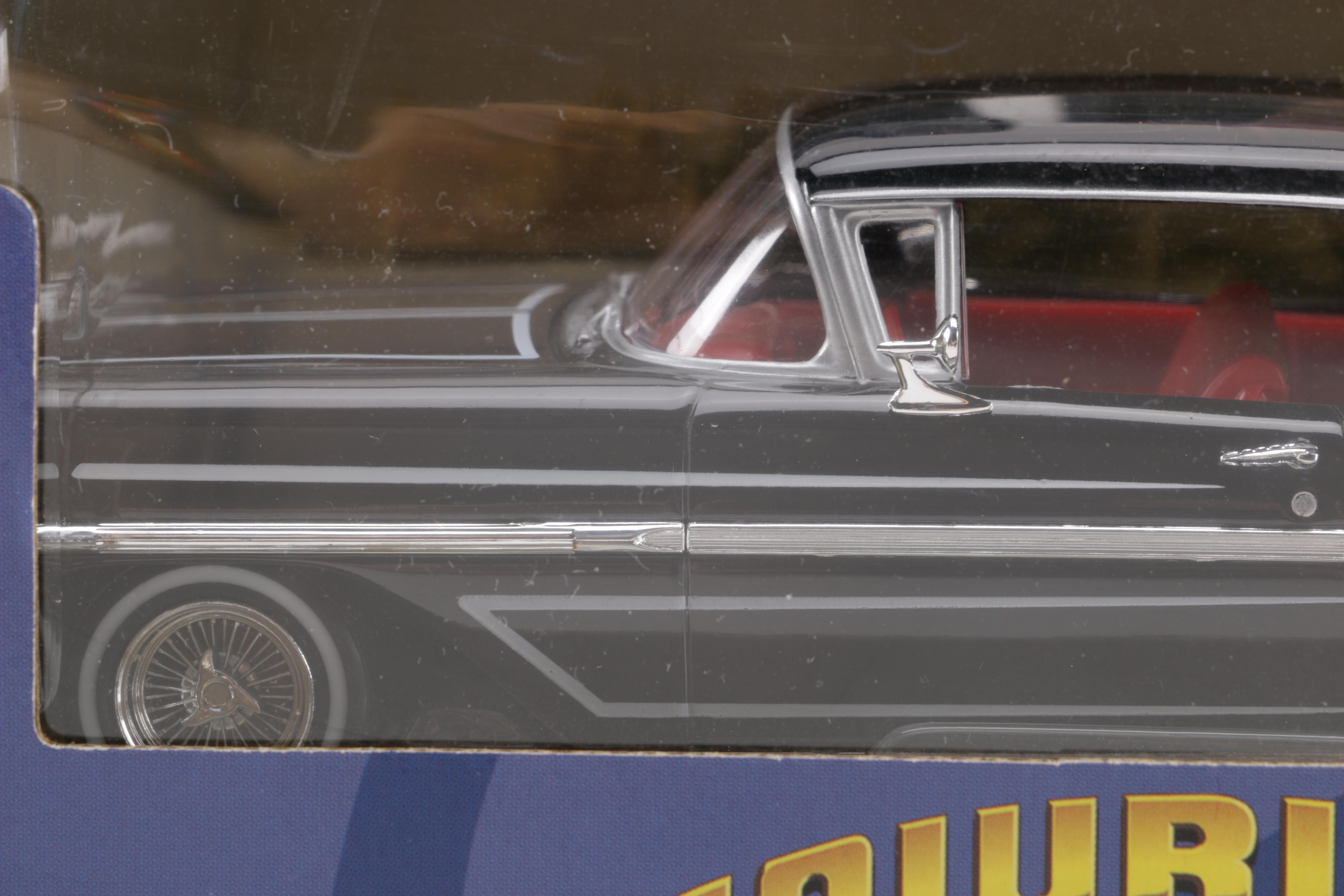 Assortment of Chevy Impala Model Kits and Die-Cast Cars