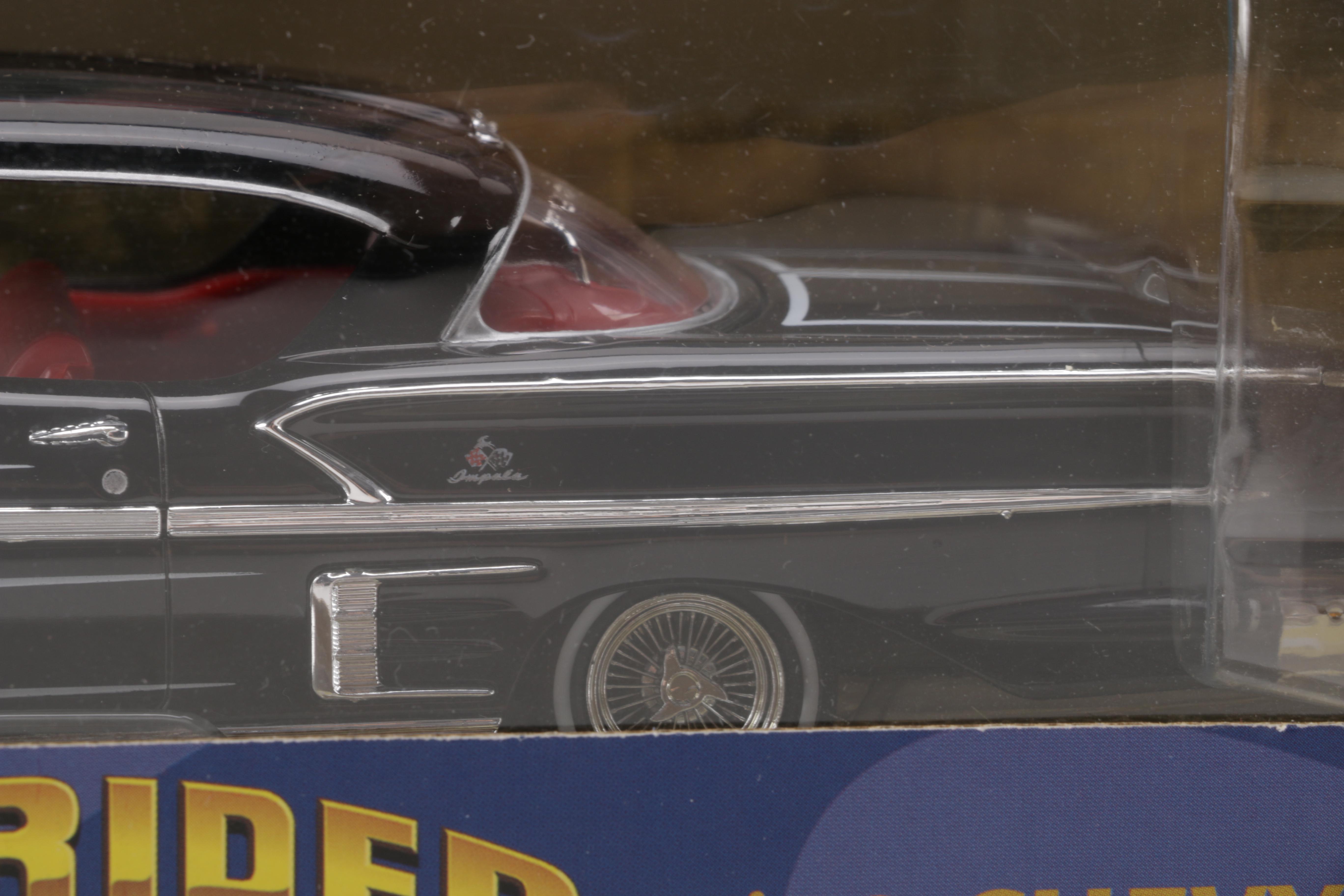 Assortment of Chevy Impala Model Kits and Die-Cast Cars
