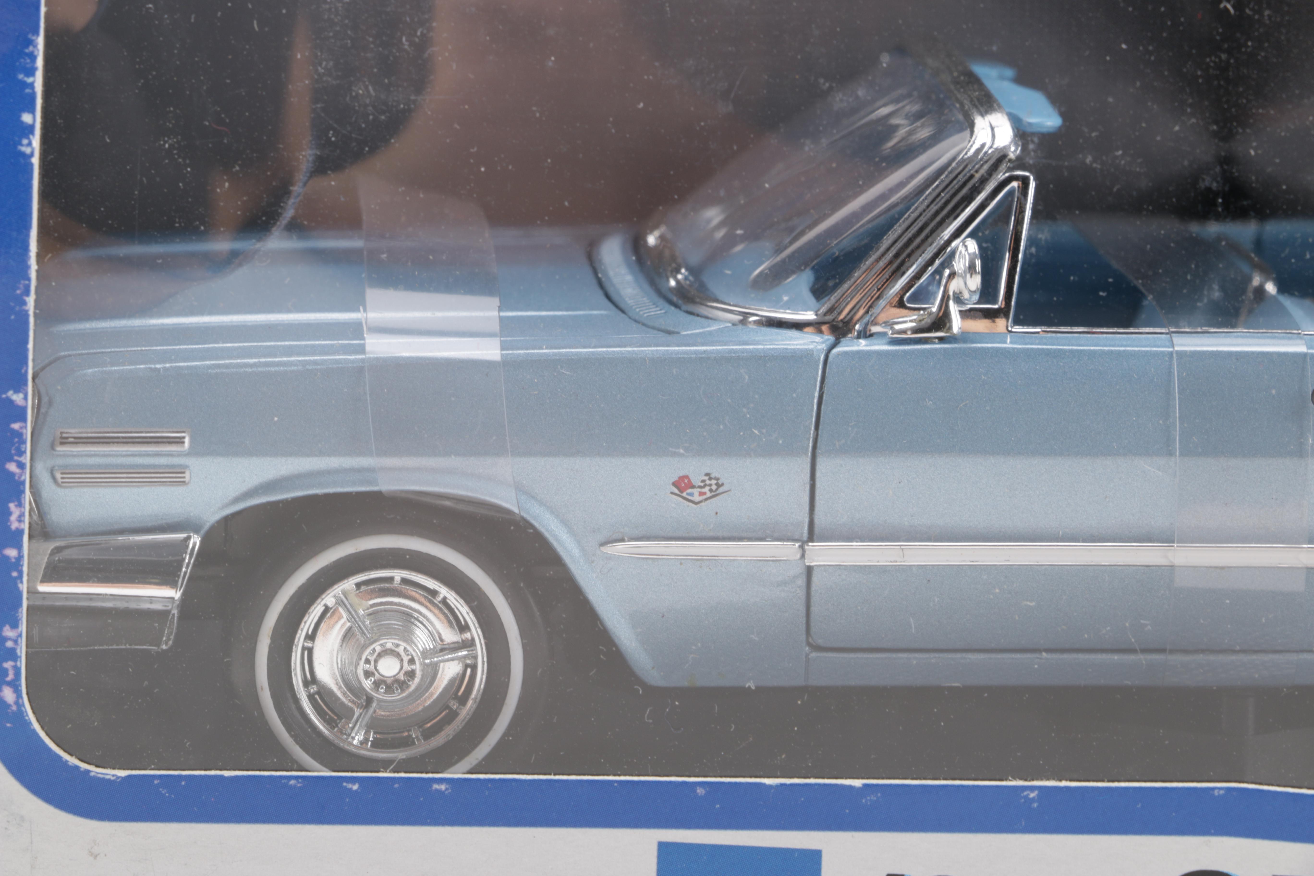 Assortment of Chevy Impala Model Kits and Die-Cast Cars