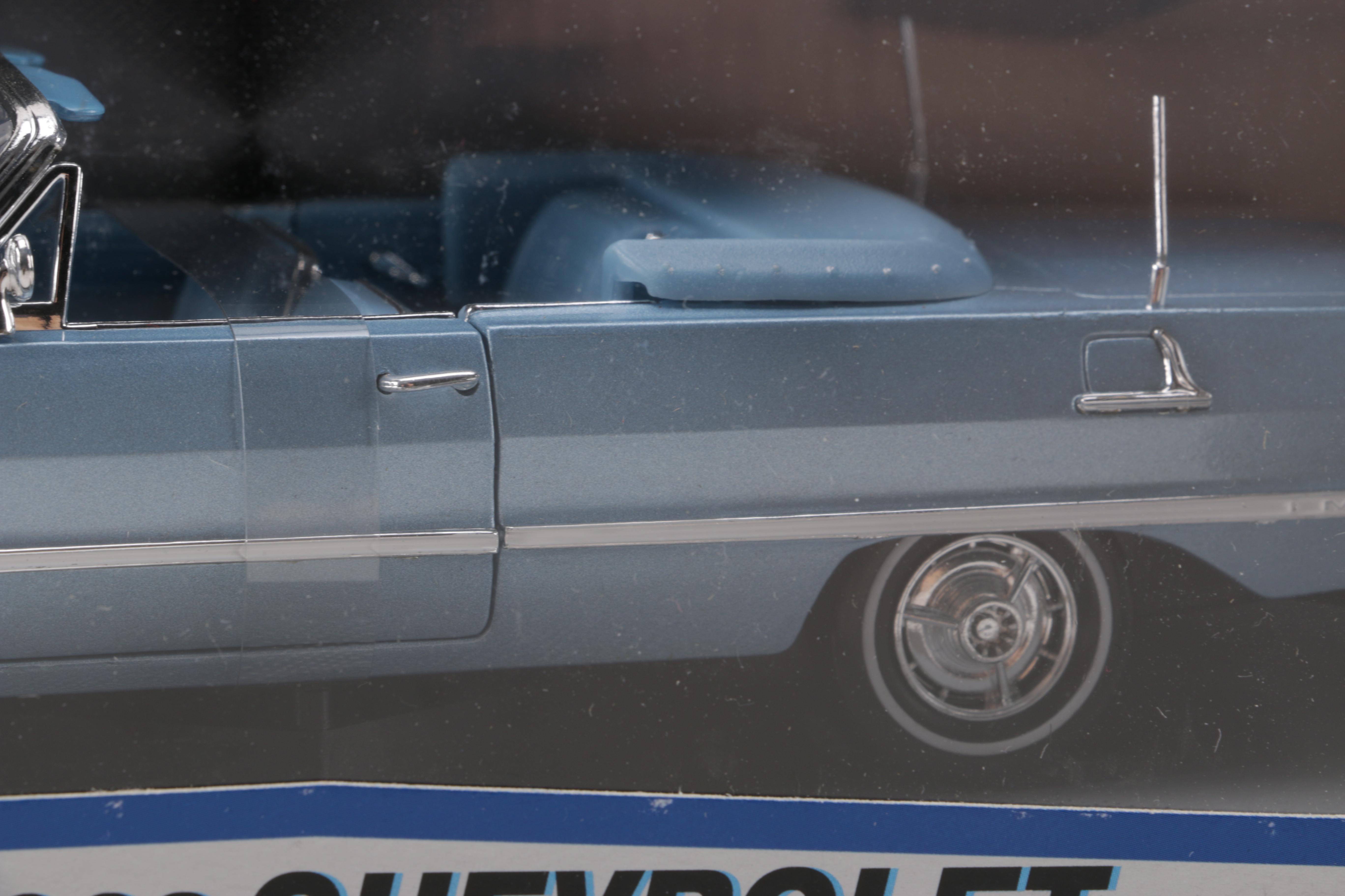 Assortment of Chevy Impala Model Kits and Die-Cast Cars