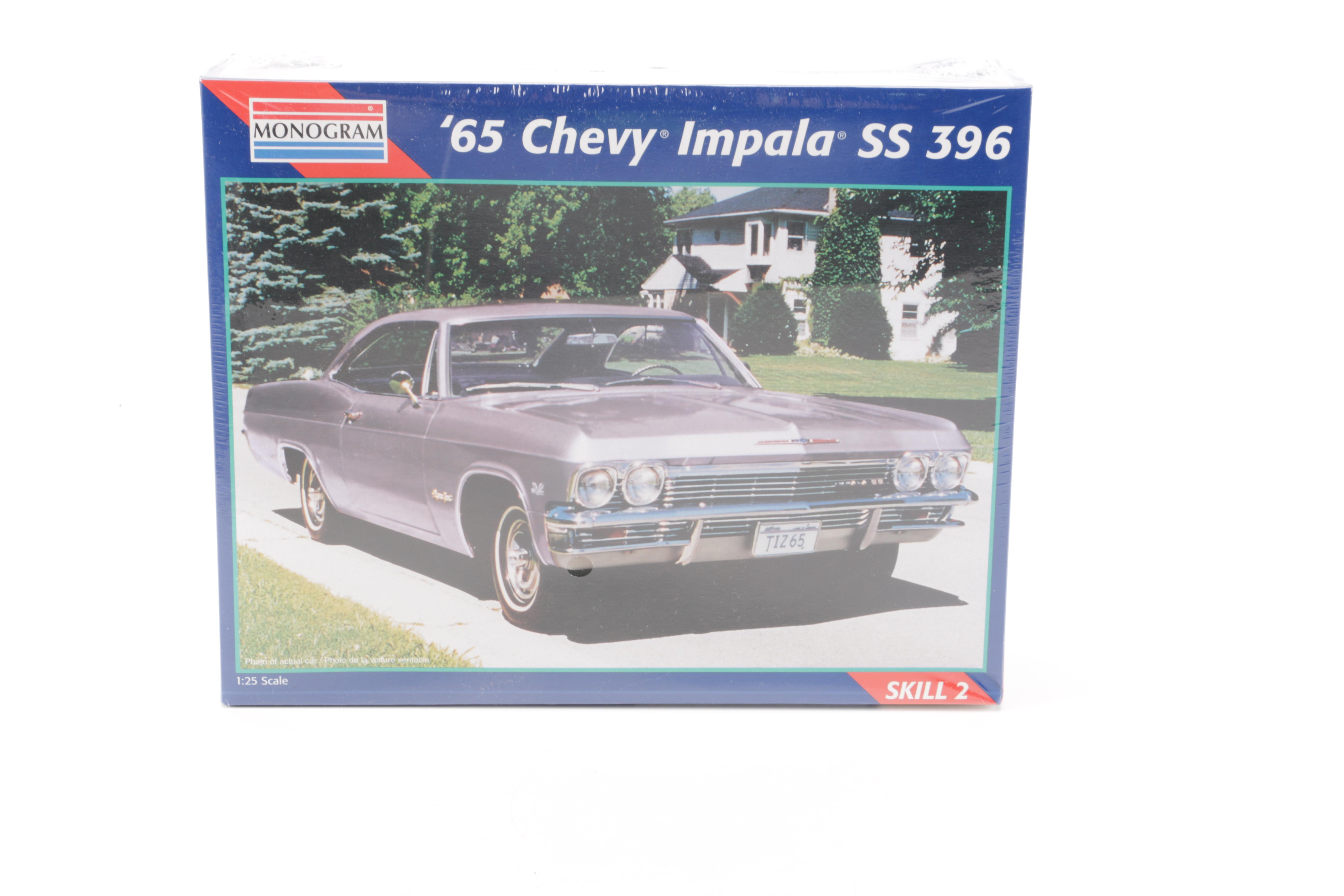 Assortment of Chevy Impala Model Kits and Die-Cast Cars