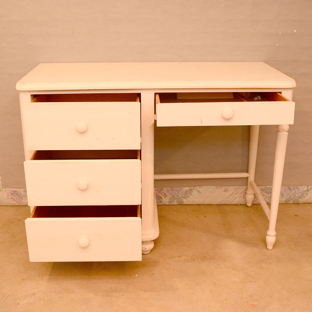 white wooden single pedestal desk