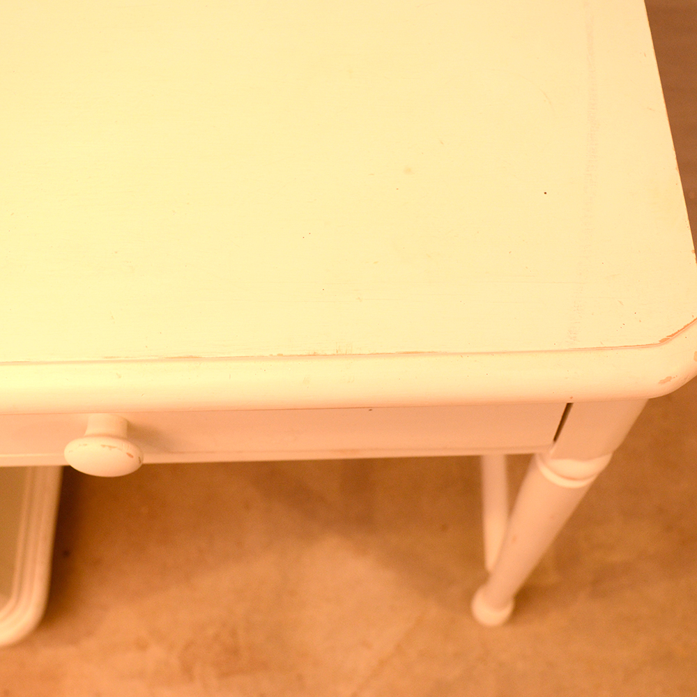 white wooden single pedestal desk