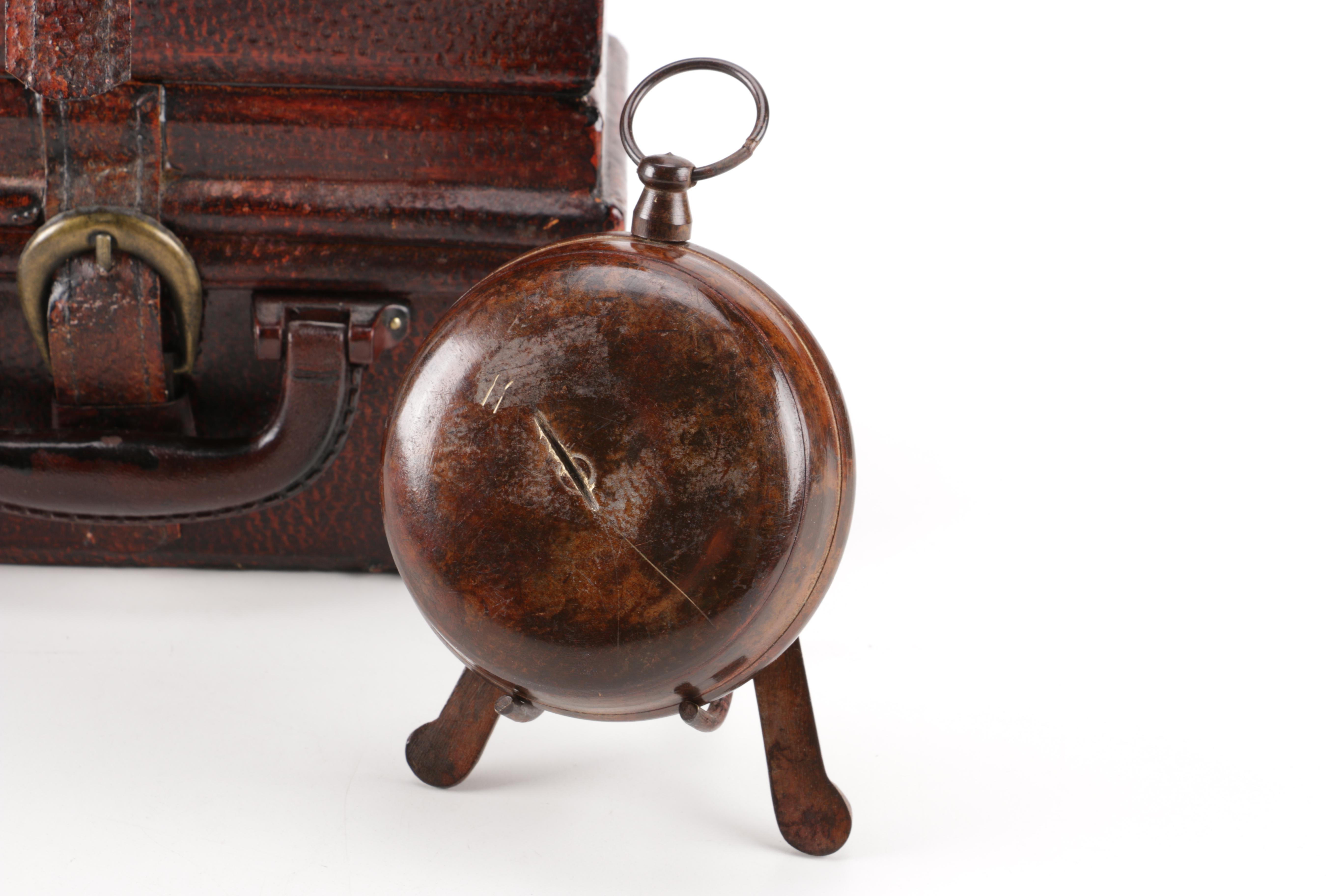 Luggage-Style Box, Pocket Watch Desk Clock, and Decorative Feather Spheres