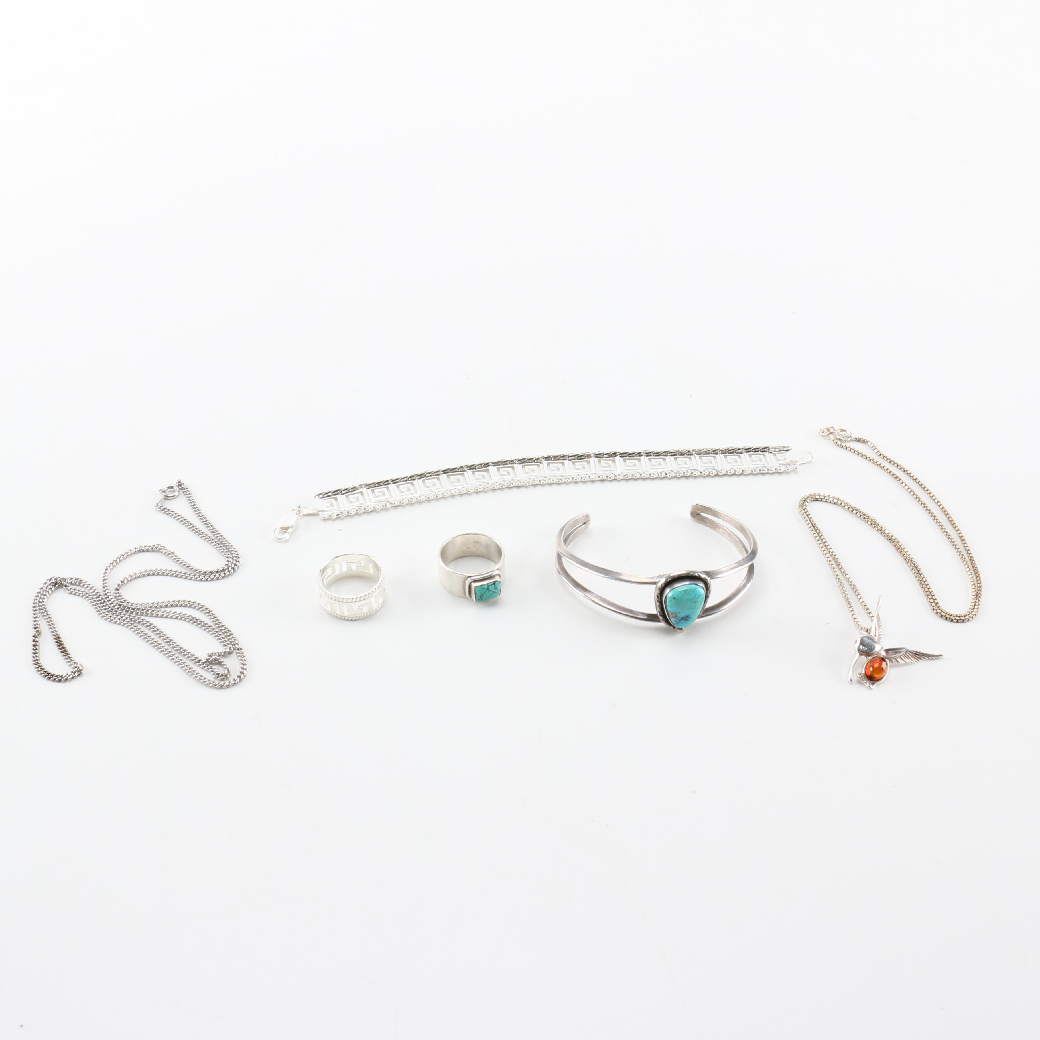 Sterling Silver Jewelry Including a Necklace With an Amber Pendant
