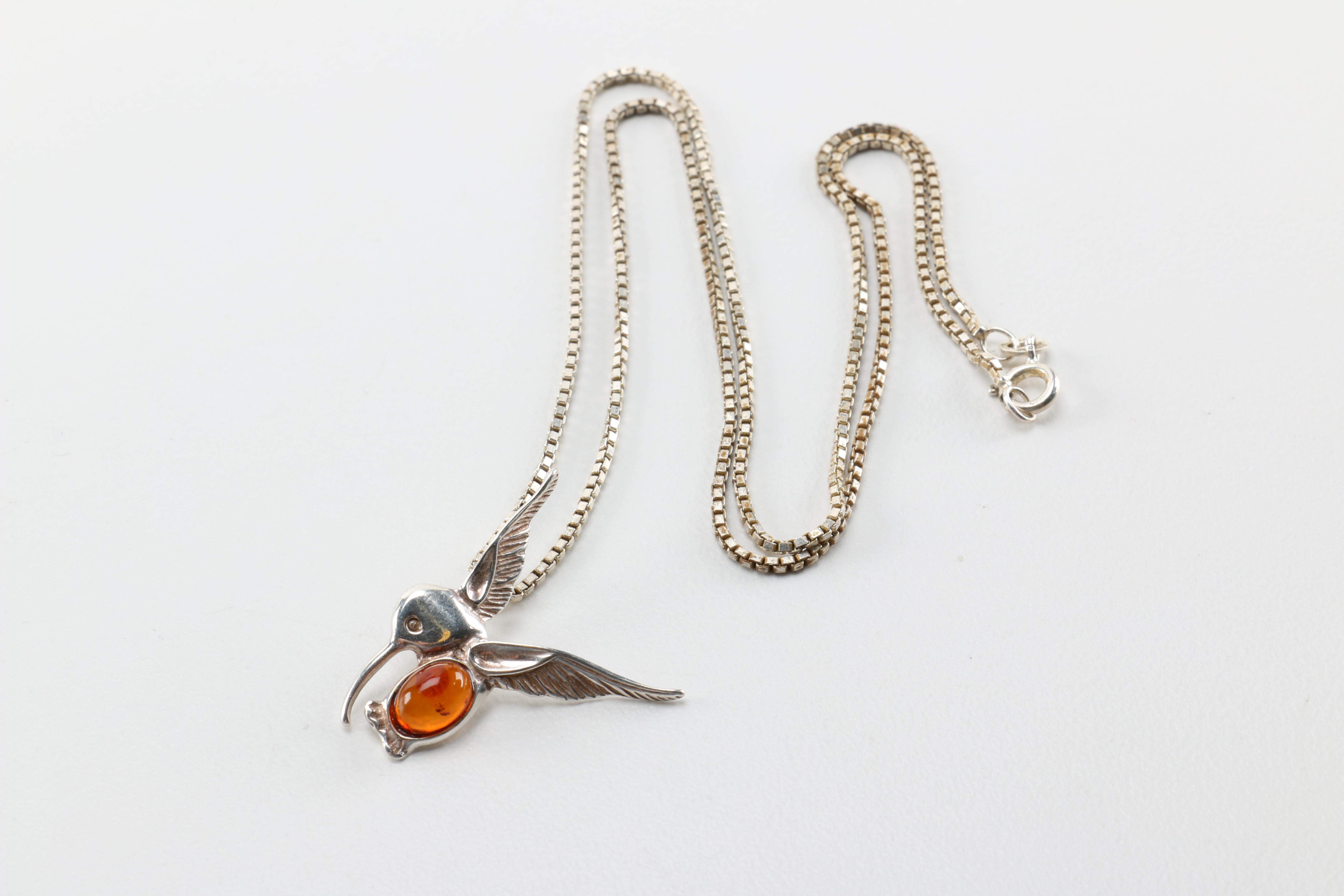 Sterling Silver Jewelry Including a Necklace With an Amber Pendant