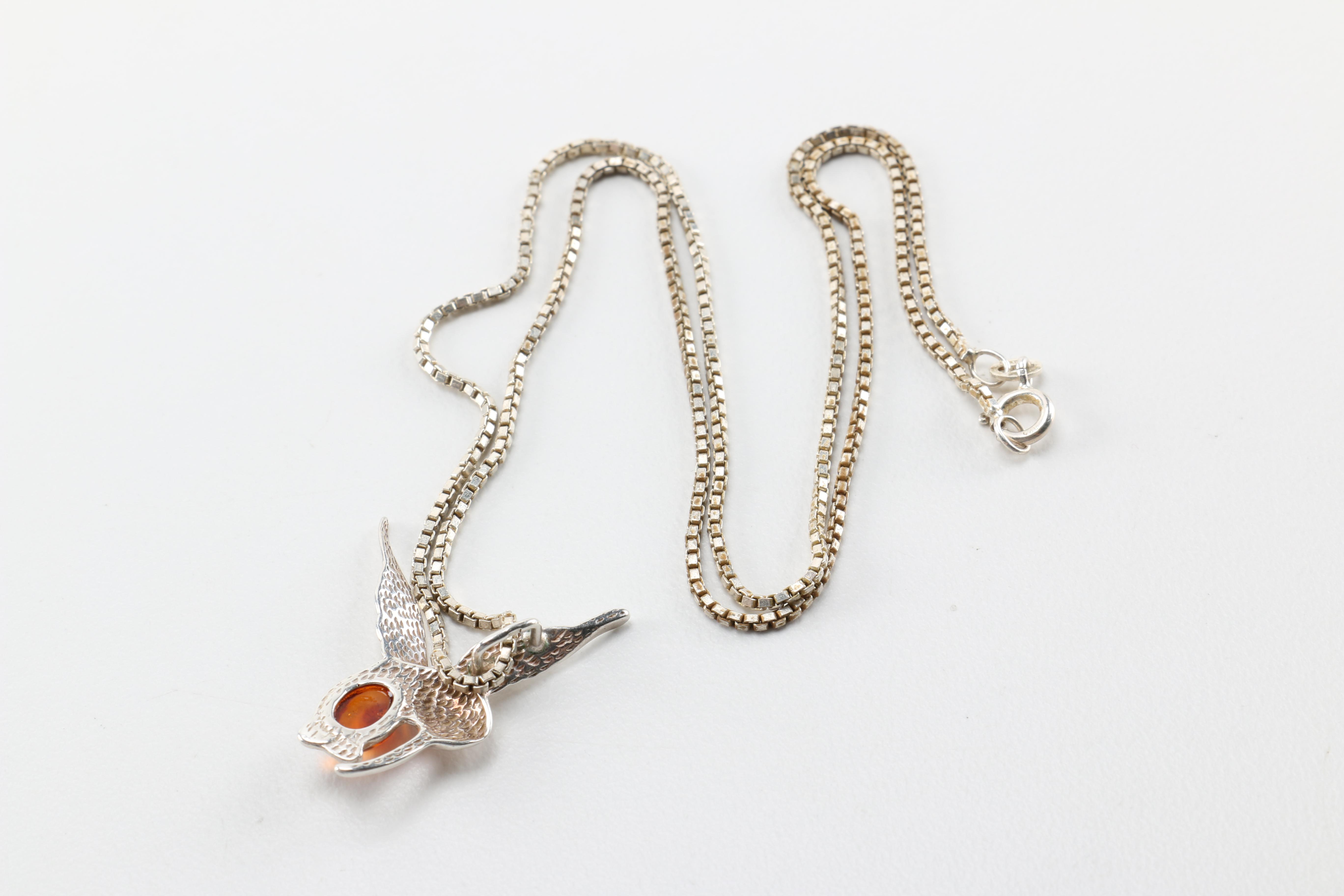 Sterling Silver Jewelry Including a Necklace With an Amber Pendant