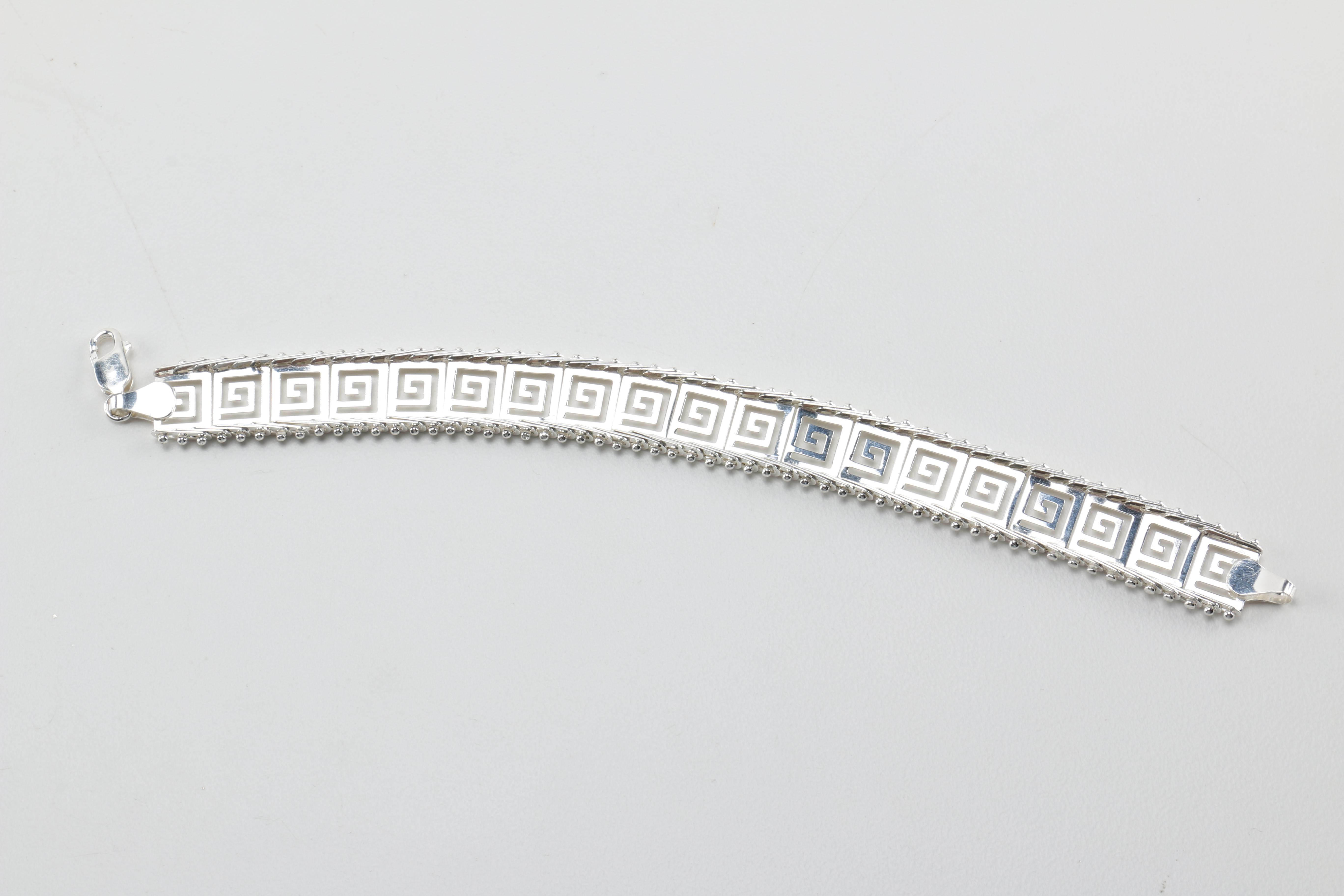 Sterling Silver Jewelry Including a Necklace With an Amber Pendant