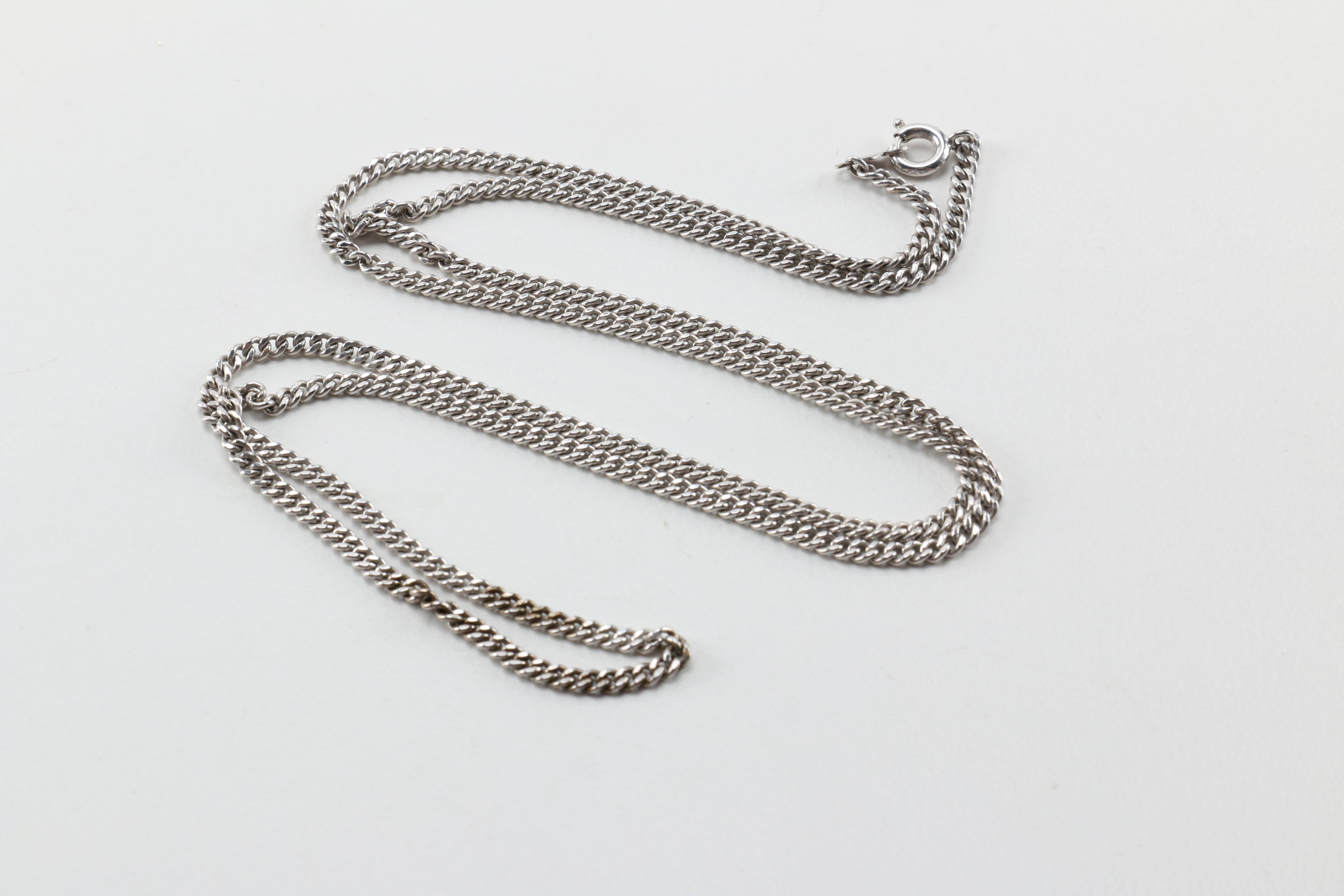 Sterling Silver Jewelry Including a Necklace With an Amber Pendant