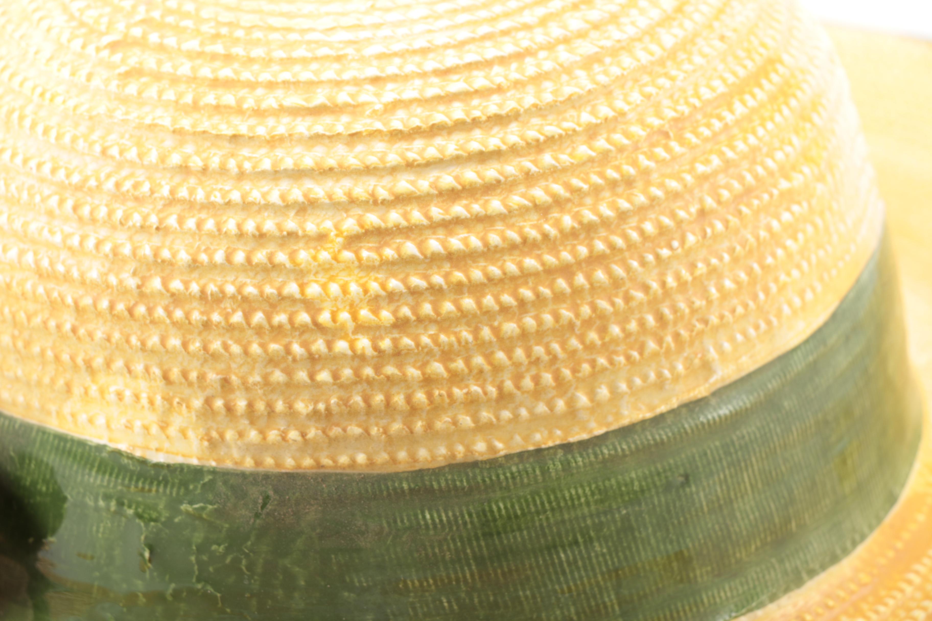 White and Brown Ceramic Sun Hat Figurines