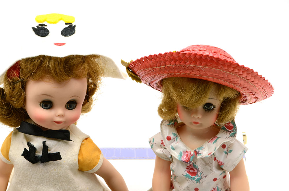 Group of Nine Collectable Dolls with Two Doll Cases