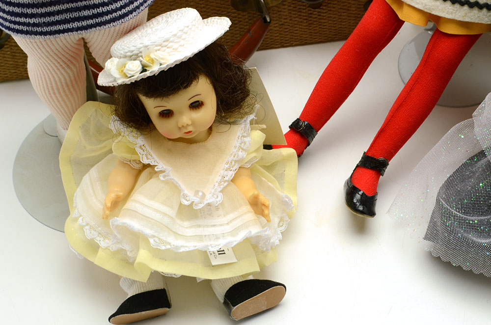 Group of Nine Collectable Dolls with Two Doll Cases