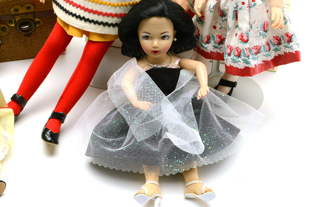 Group of Nine Collectable Dolls with Two Doll Cases