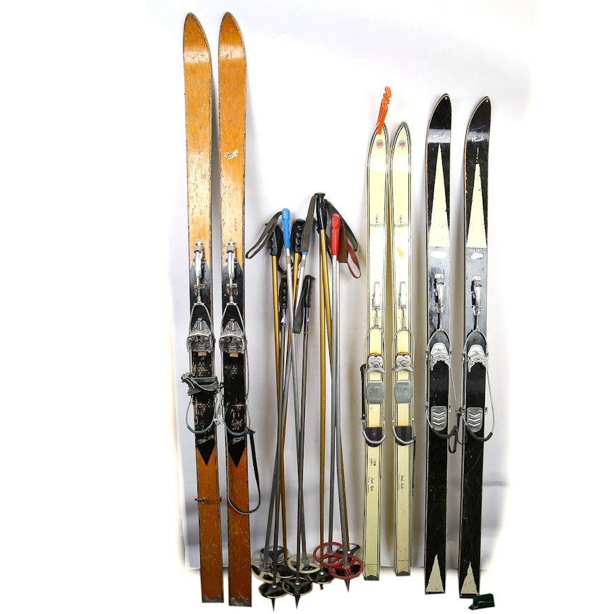 Variety of Vintage Skis and Ski Poles
