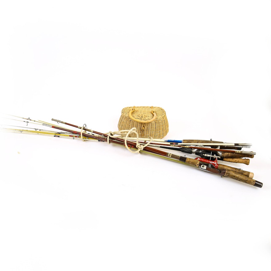 Variety of Vintage Fishing Poles and Creel