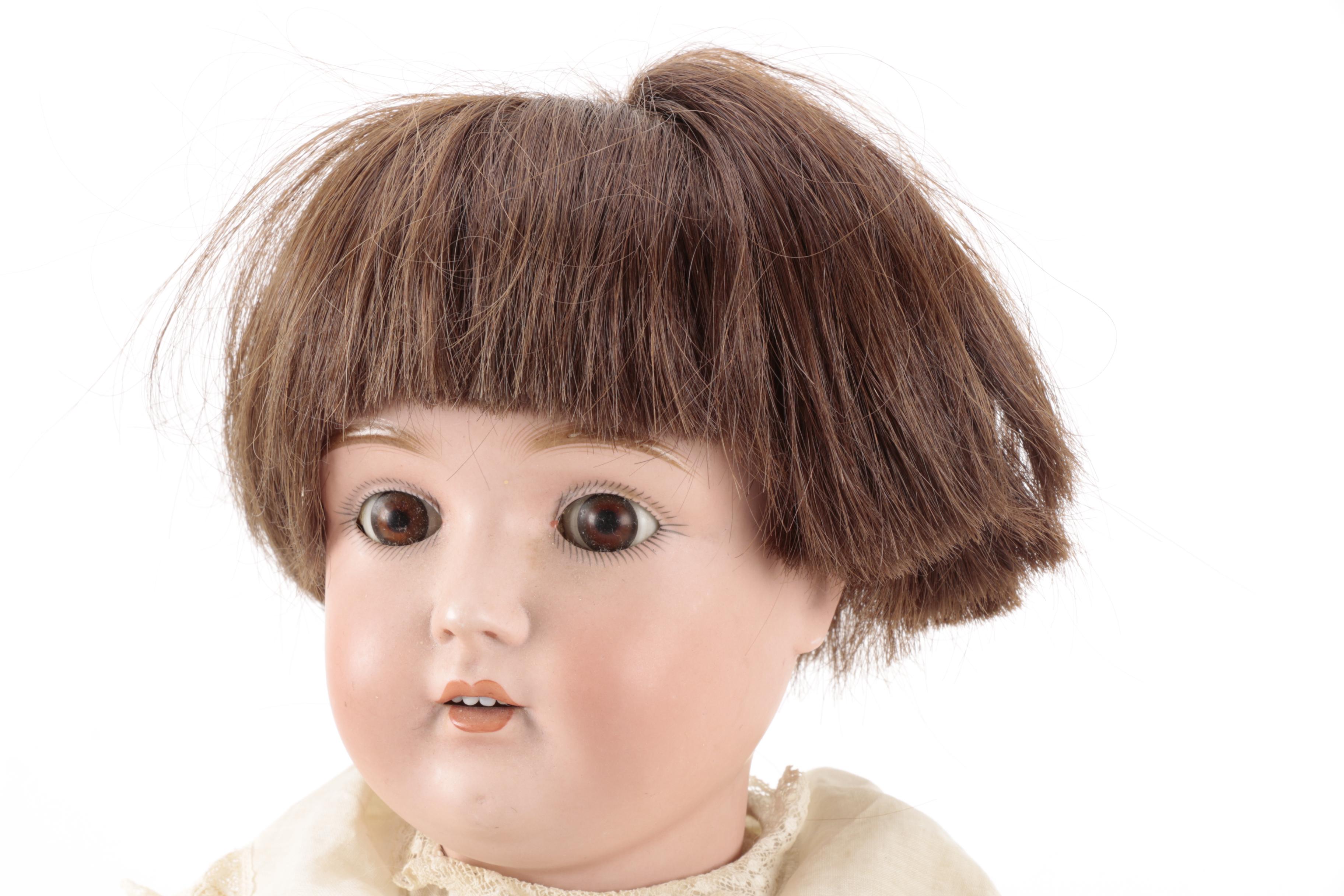 Pair of Bisque Porcelain Dolls