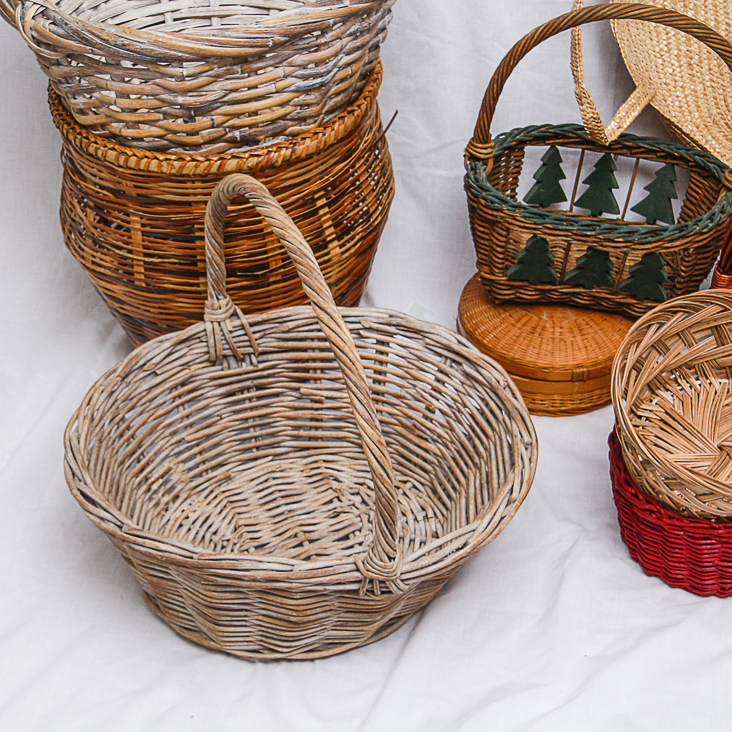 Collection of Various-Sized Straw Baskets