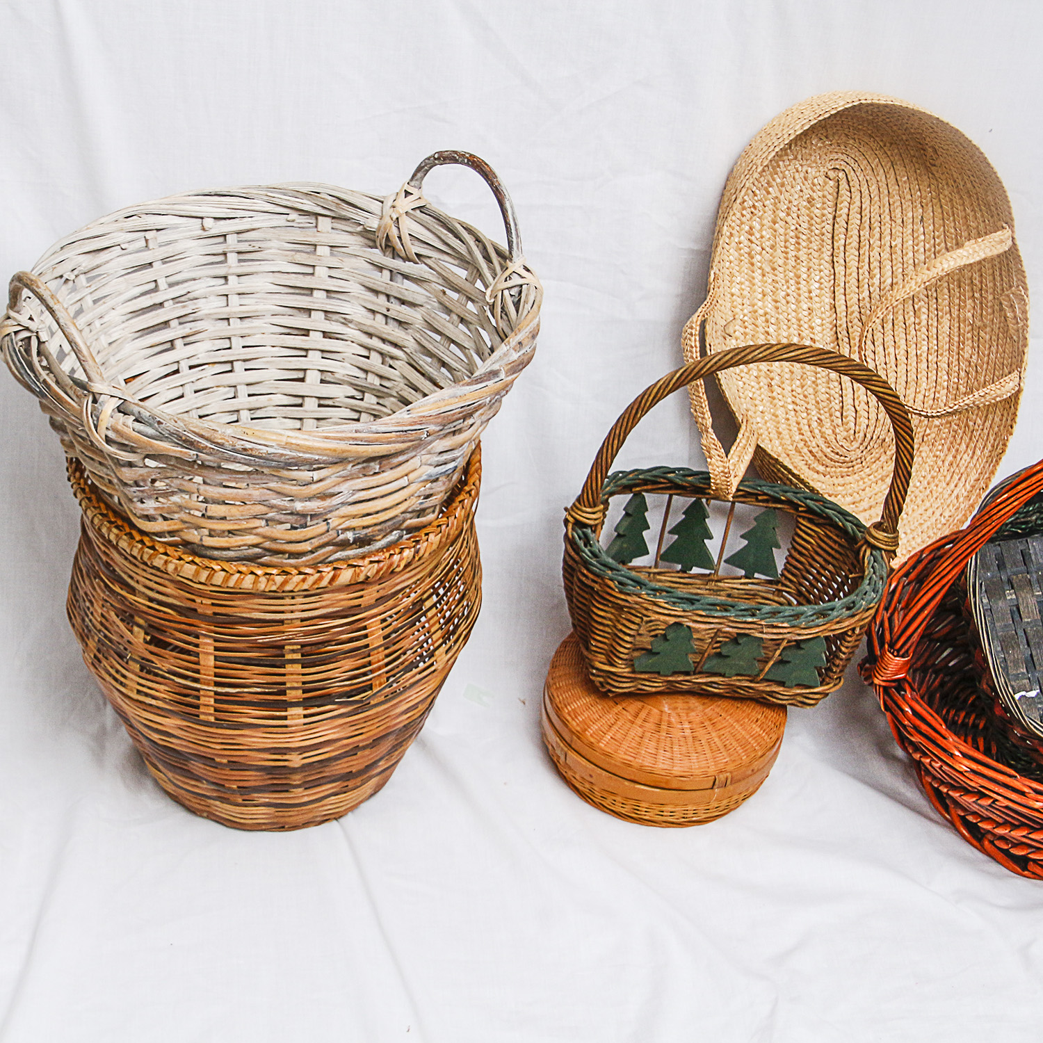Collection of Various-Sized Straw Baskets