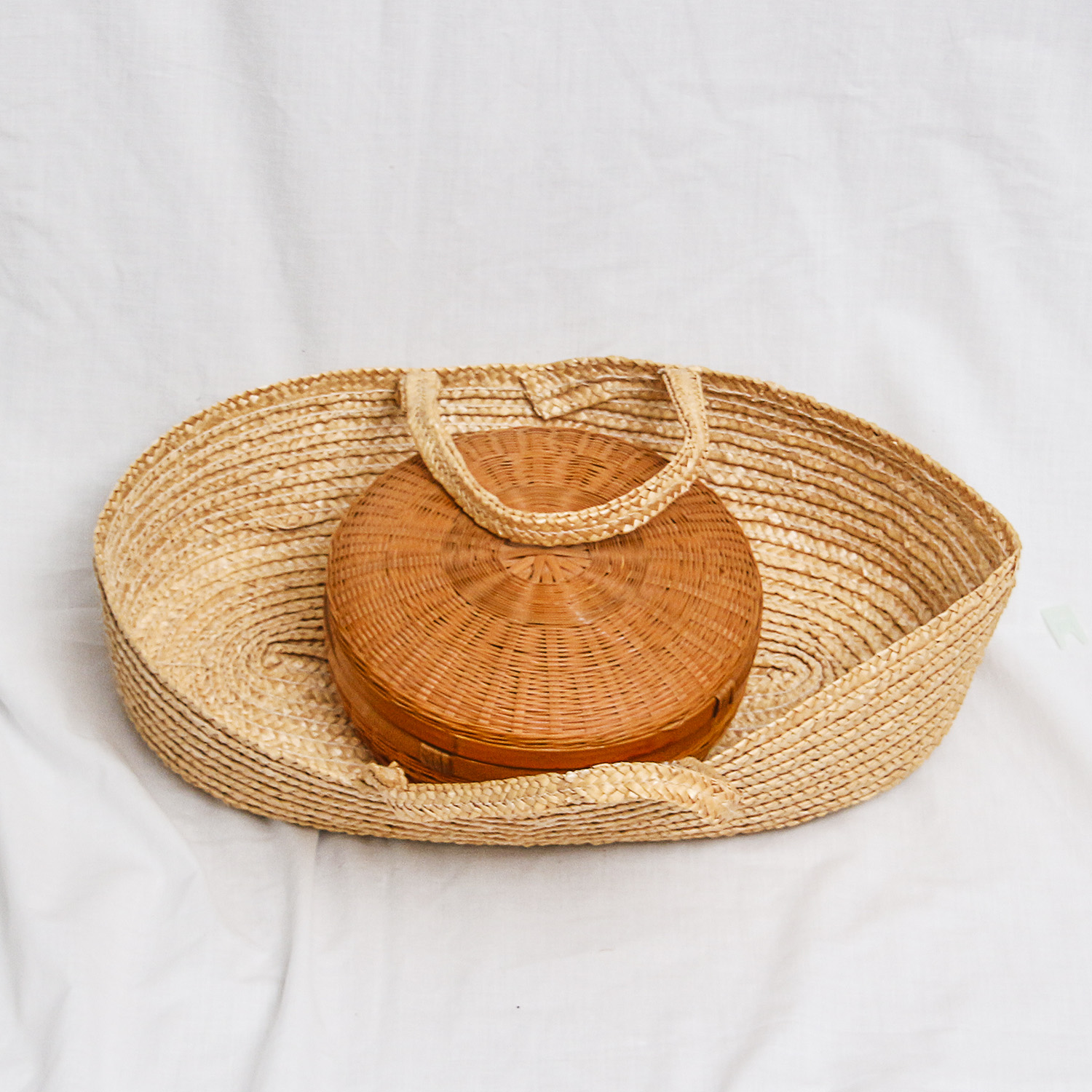 Collection of Various-Sized Straw Baskets