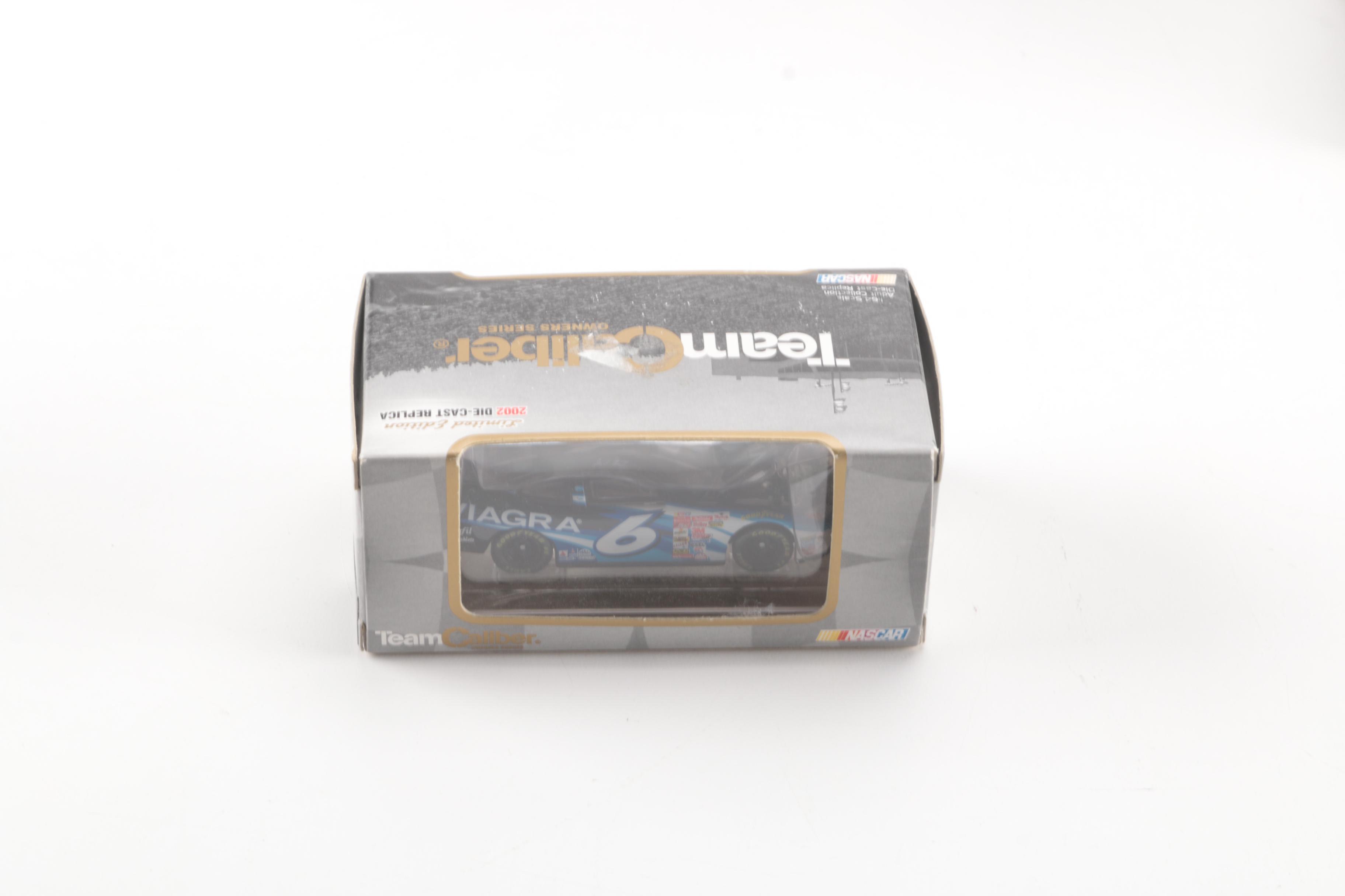 Collection of Eight Model Cars and One Metal Plaque