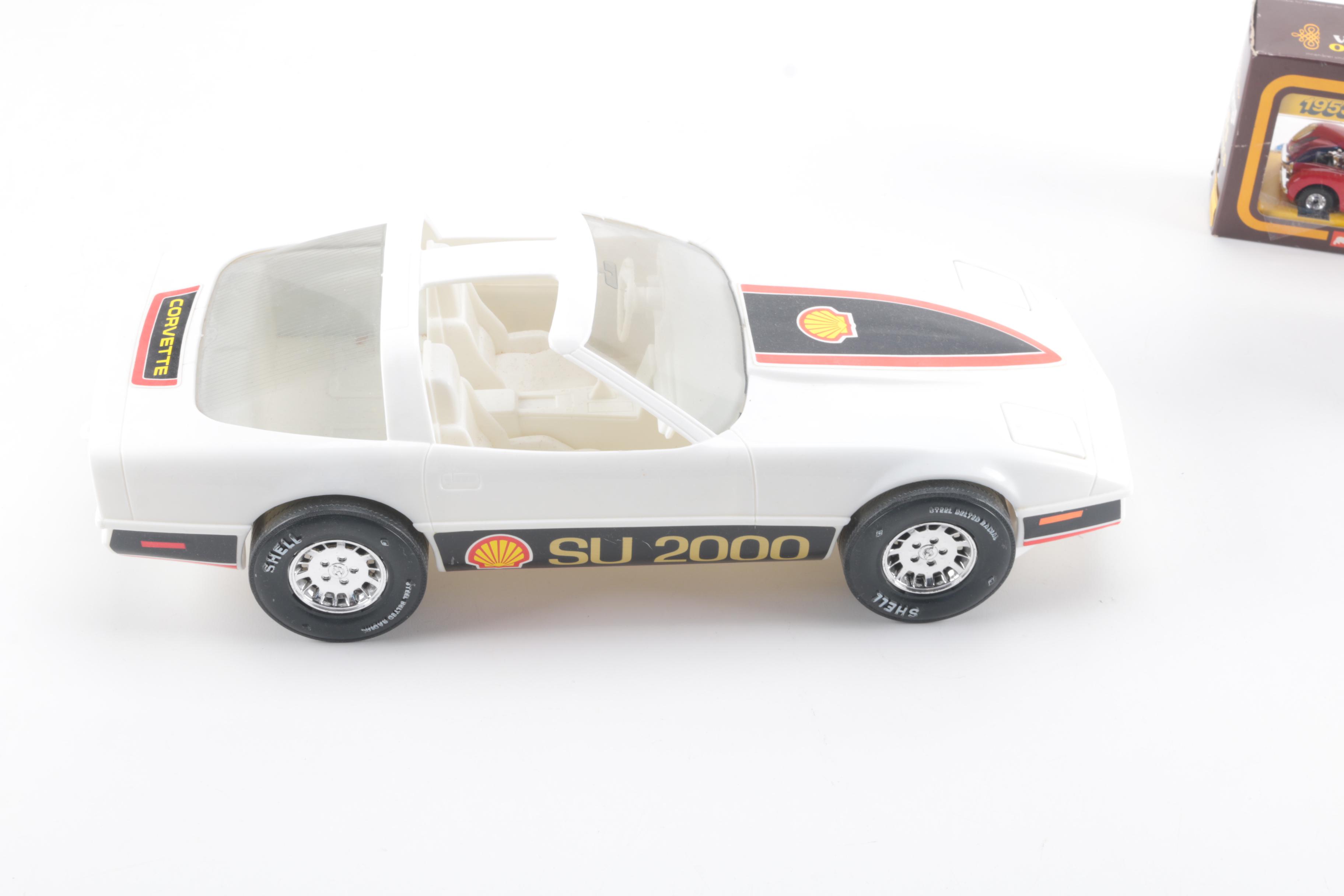 Collection of Eight Model Cars and One Metal Plaque